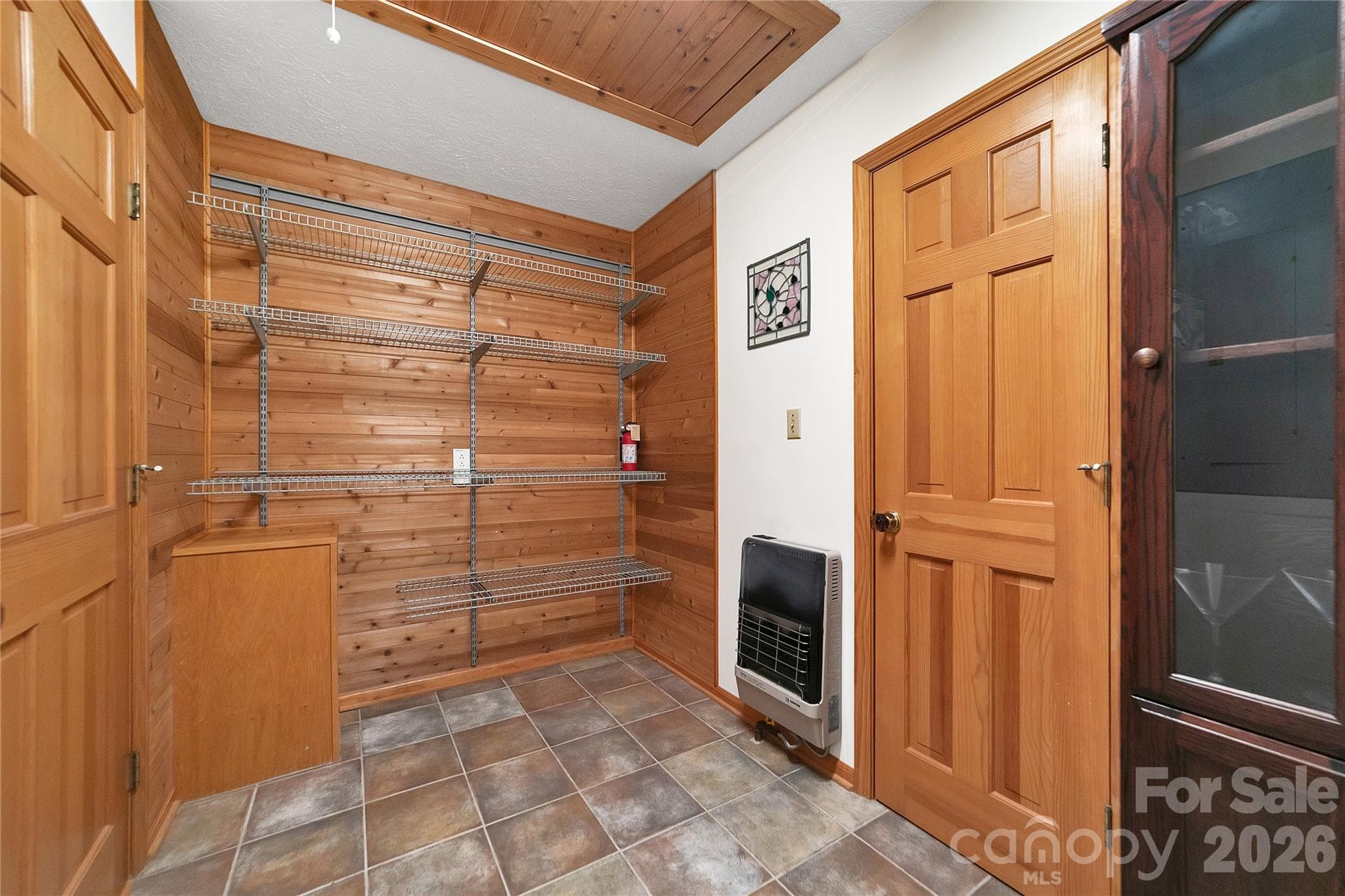 This pantry is much larger than many walk-in closets! Plenty of space to store kitchen related items and much much more! Pull down stairs to the attic is in here as well. - 275 Hubbard Hollow Road, Rosman