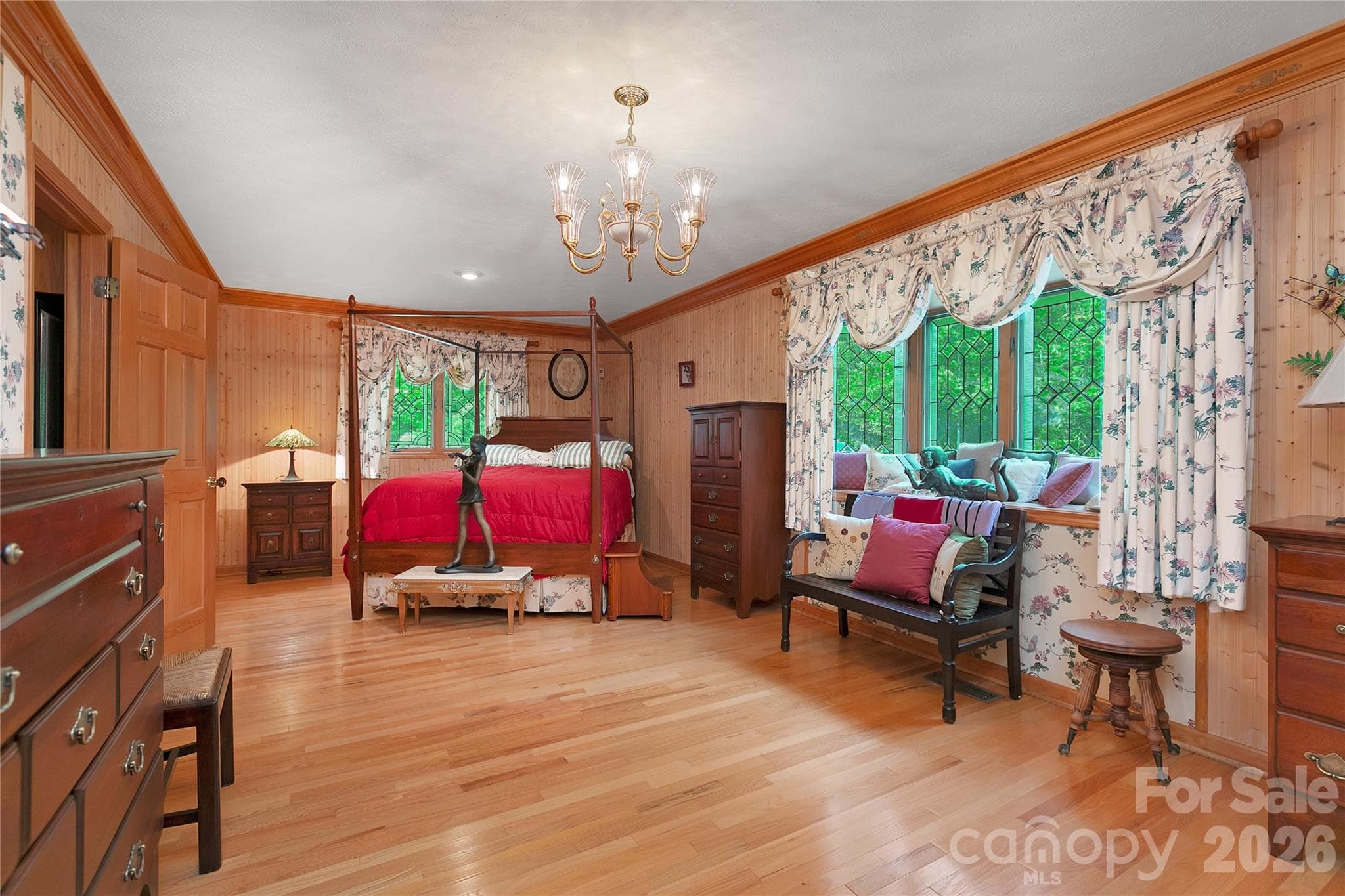 Primary bedroom can come complete with queen "Poster Bed" and all the other eloquent furnishings! Stained glass windows all around with a bay window looking out to the lush surroundings and "waterfall to be" outside! - 275 Hubbard Hollow Road, Rosman