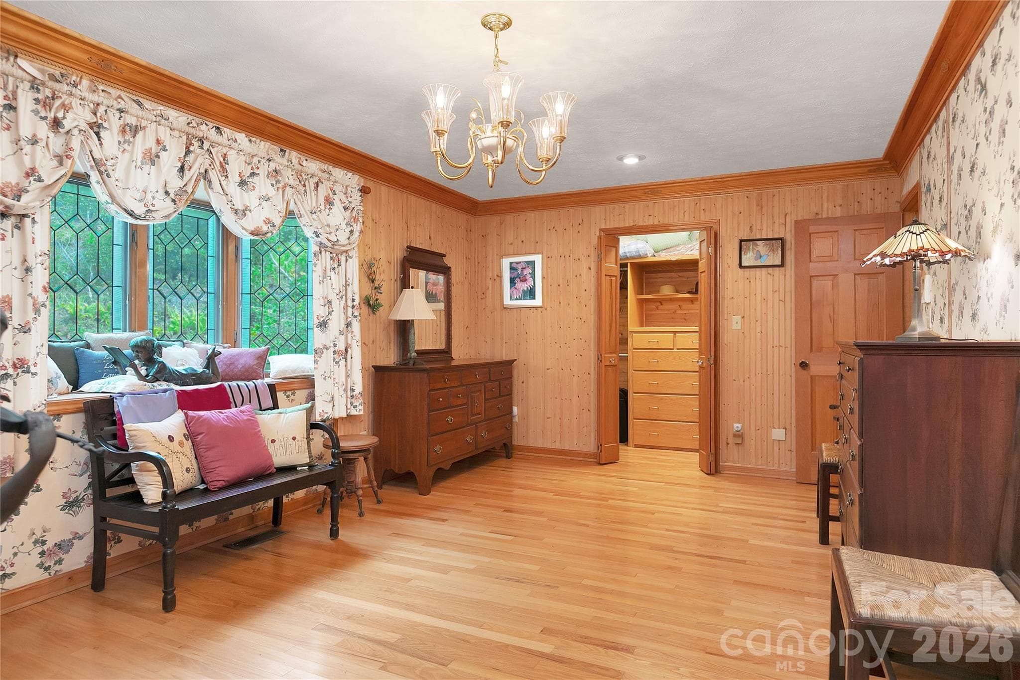 Primary bedroom has lots of eloquent furnishings! Stained glass bay window looks out to the lush surroundings and "waterfall to be" outside! - 275 Hubbard Hollow Road, Rosman