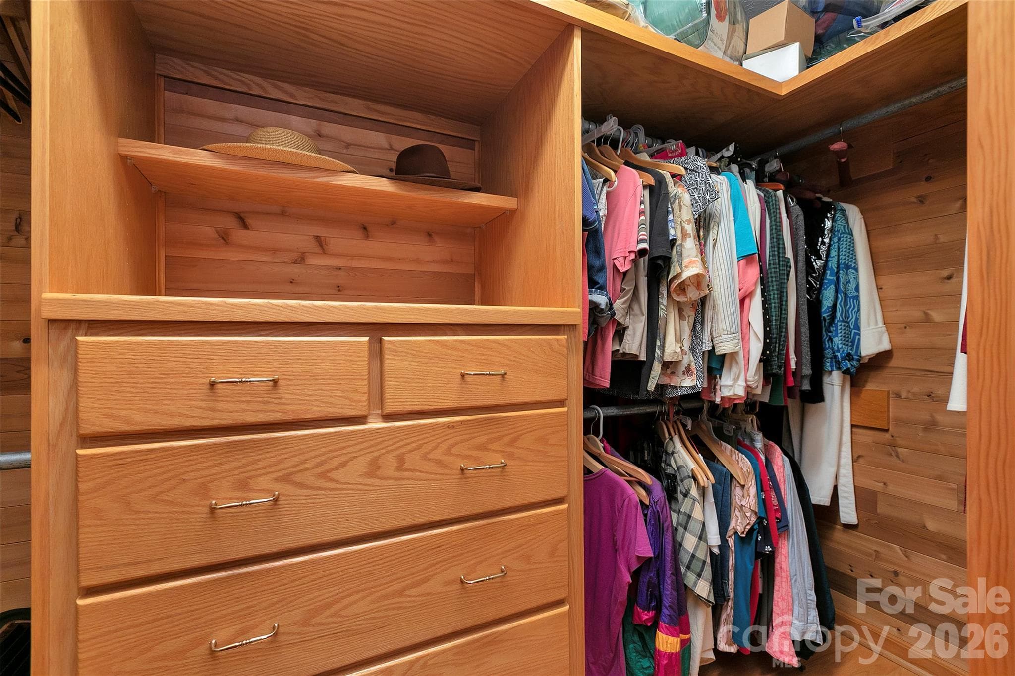 Primary walk-in closet with his and her sides and space for drawers in between! - 275 Hubbard Hollow Road, Rosman