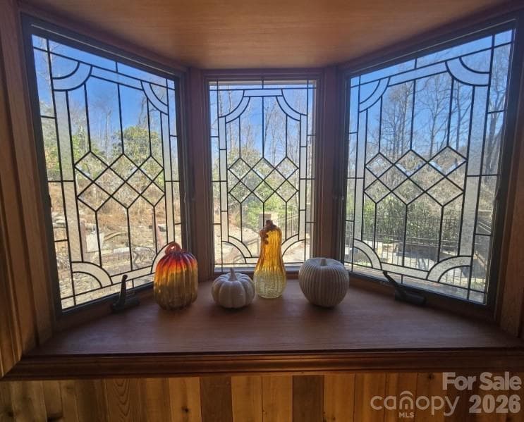 These stained-glass windows in the bonus room look out over Lady Bugs Garden and in the afternoon let in some wonderful light.! - 275 Hubbard Hollow Road, Rosman
