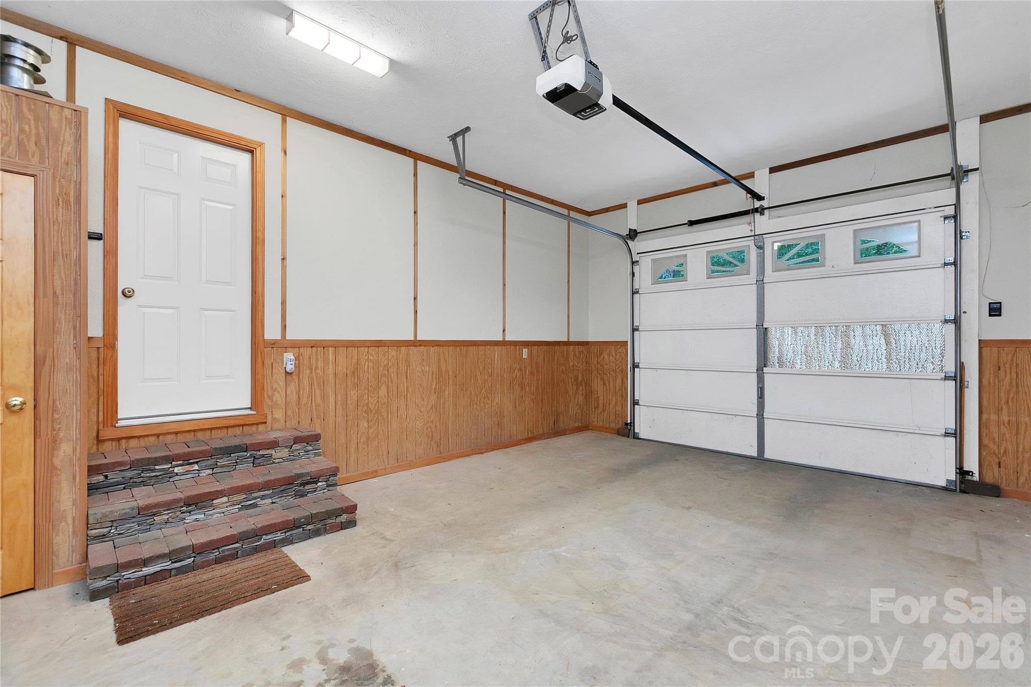 Single car garage has custom stone and brick steps that take you right into the entrance way / foyer! - 275 Hubbard Hollow Road, Rosman