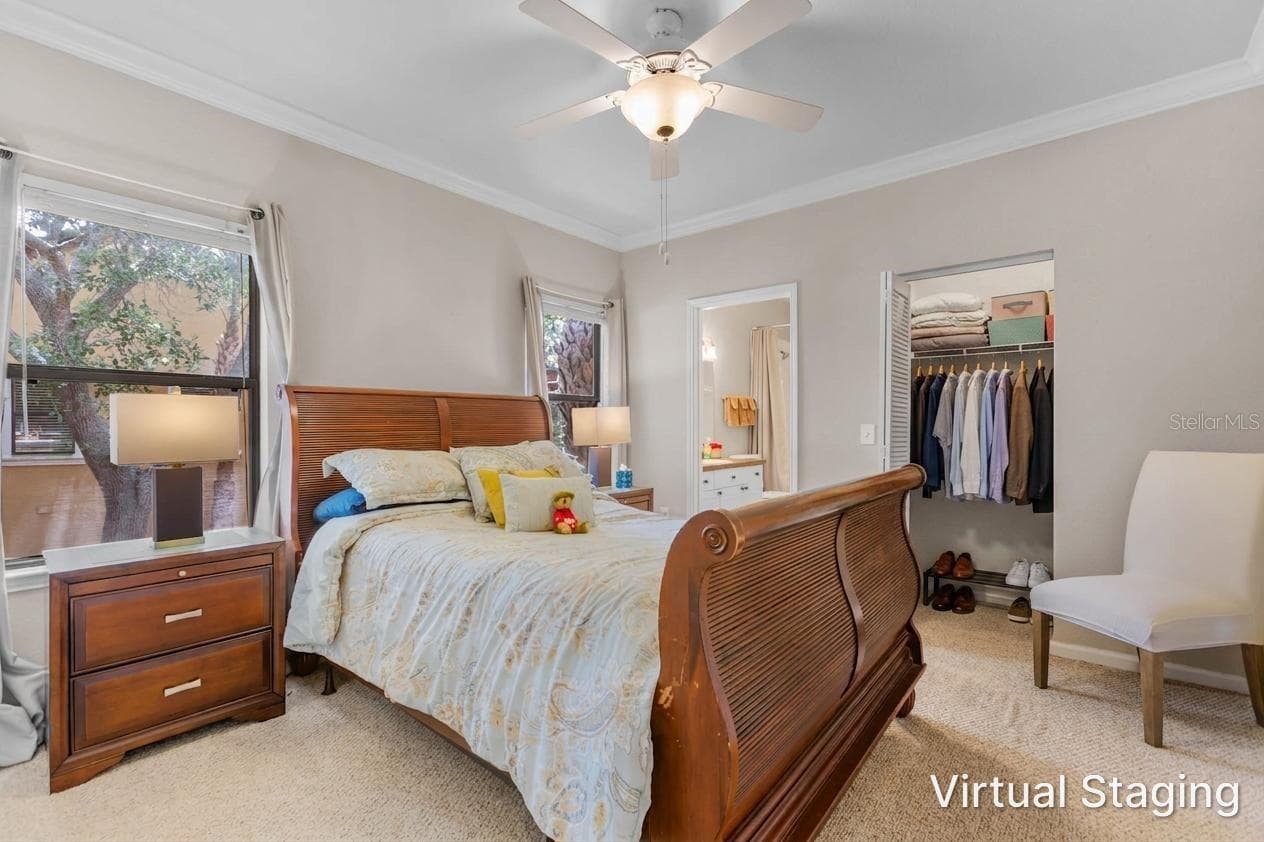 Walk-in closet has virtual staged clothes - 2176 PORTOFINO PL #6-2612, PALM HARBOR