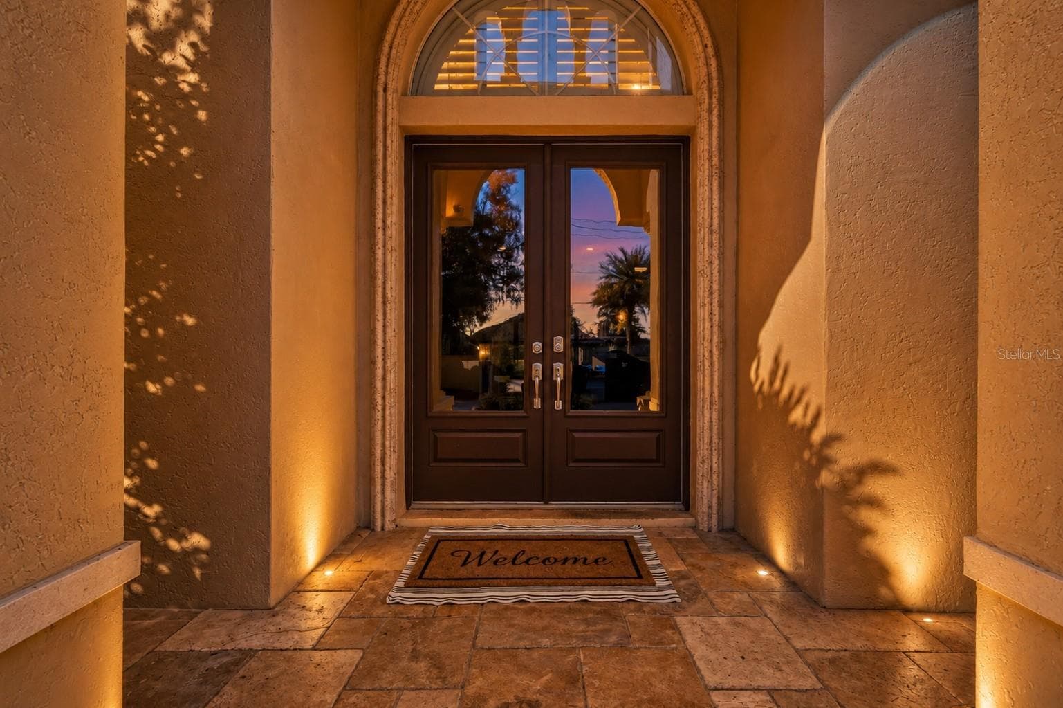 Welcoming Arched Entry at Dusk - 19165 GERACI RD, LUTZ