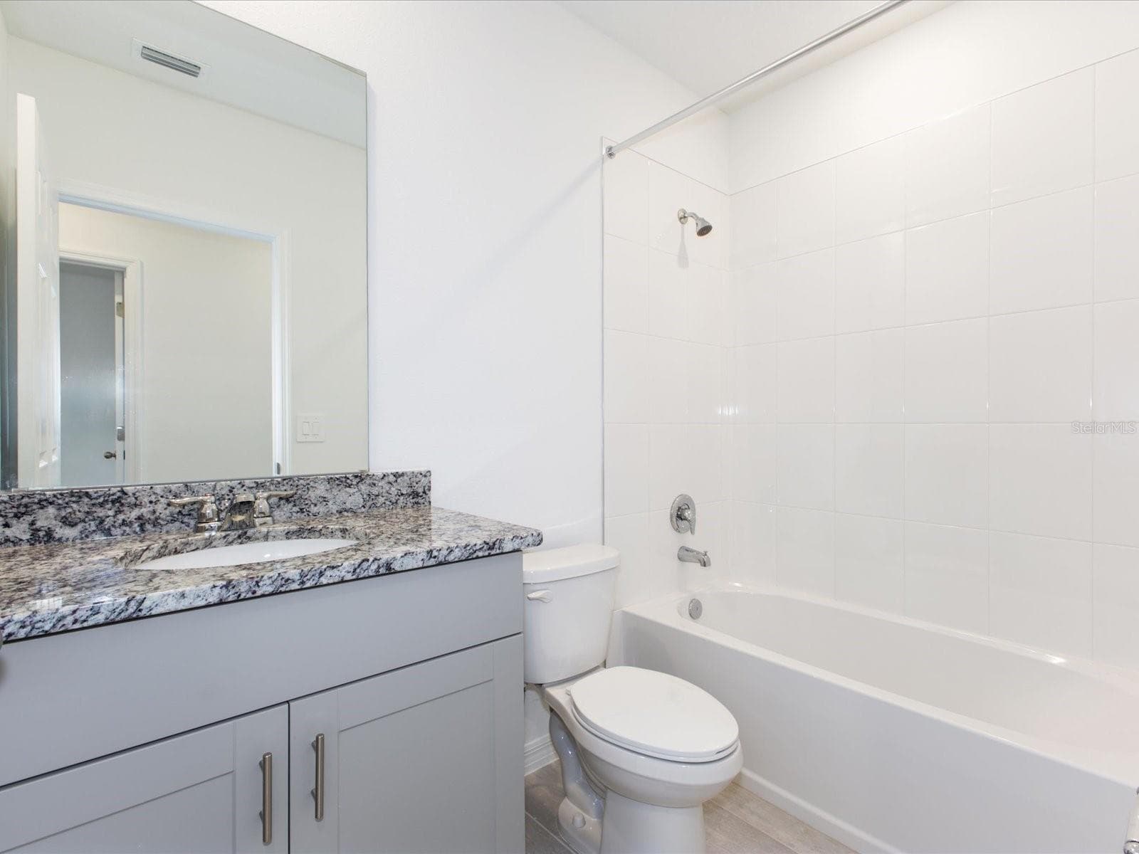Photo is not of the actual home, but is an inspirational photo of builder’s model home and may depict options, furnishings, and/or decorator features that are not included - 2880 WILD OLIVE DR, ST CLOUD