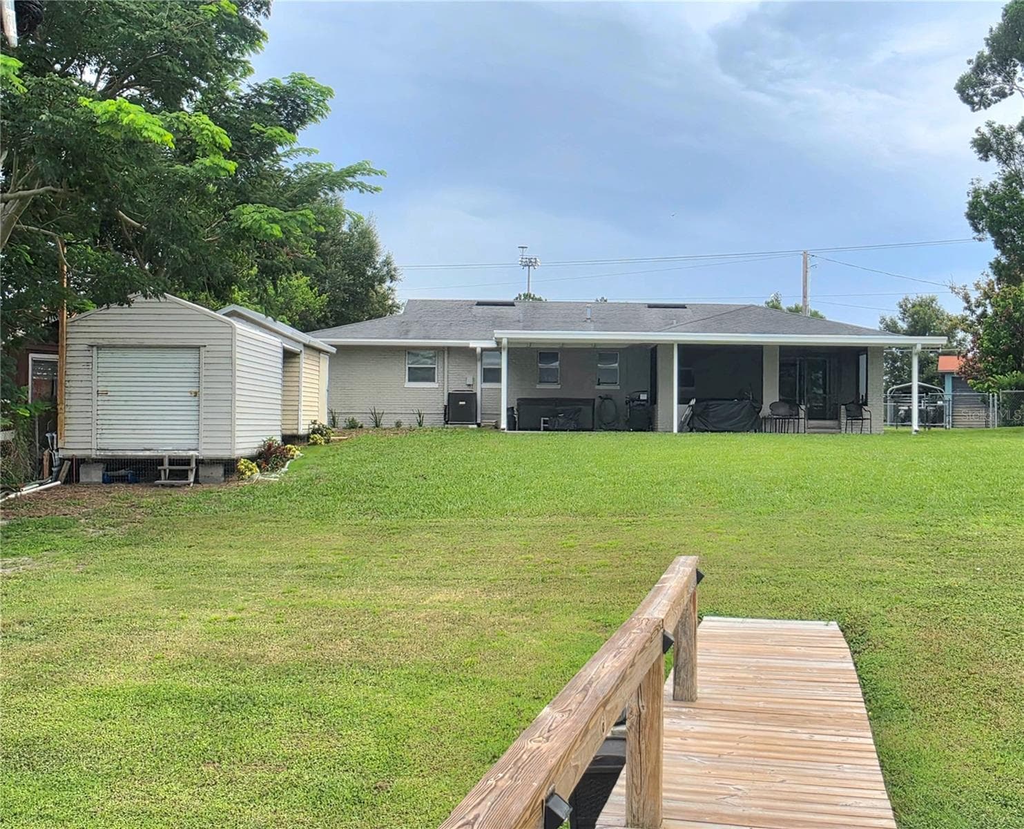 Back of home view from the dock - 1380 EAGLE AVE E, EAGLE LAKE