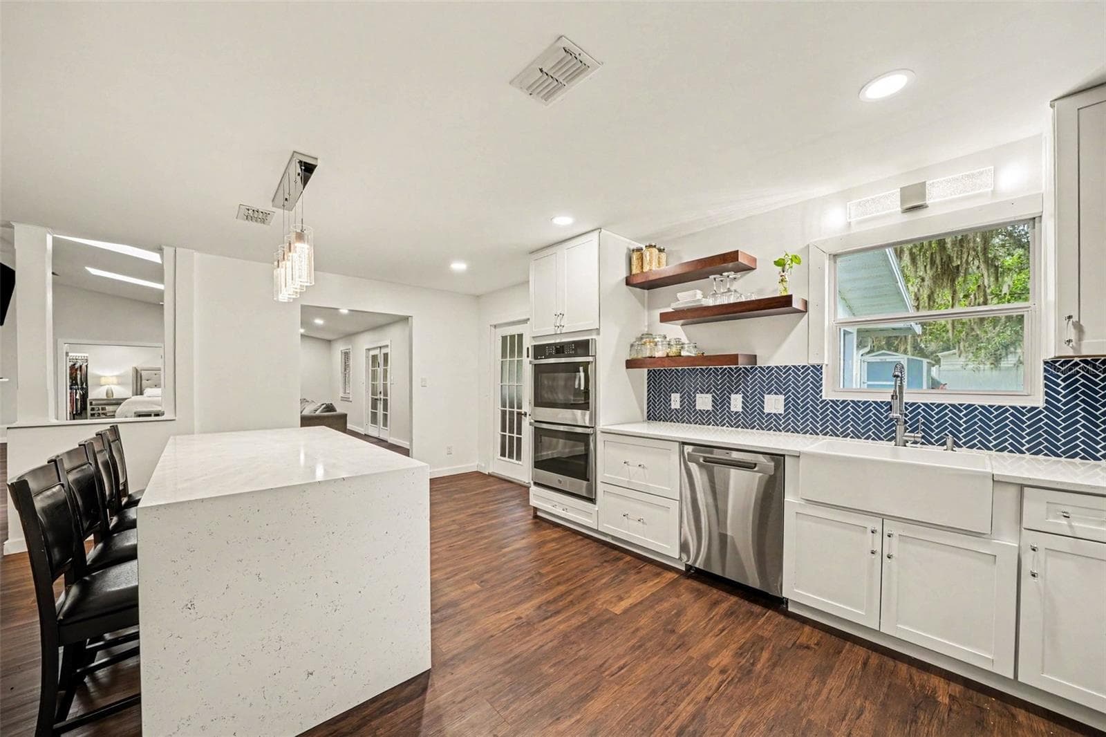 Gorgeous Kitchen with decorative blue tile backsplash & double Oven - 1592 SKYLINE DR, KISSIMMEE