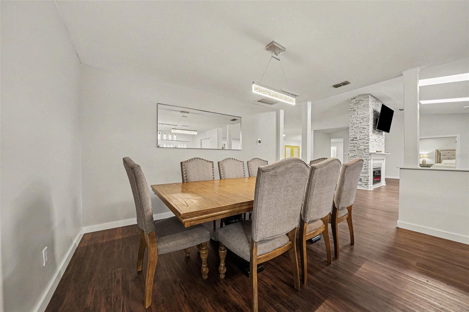 Dining Area accented by columns w/seating for 8+ - 1592 SKYLINE DR, KISSIMMEE