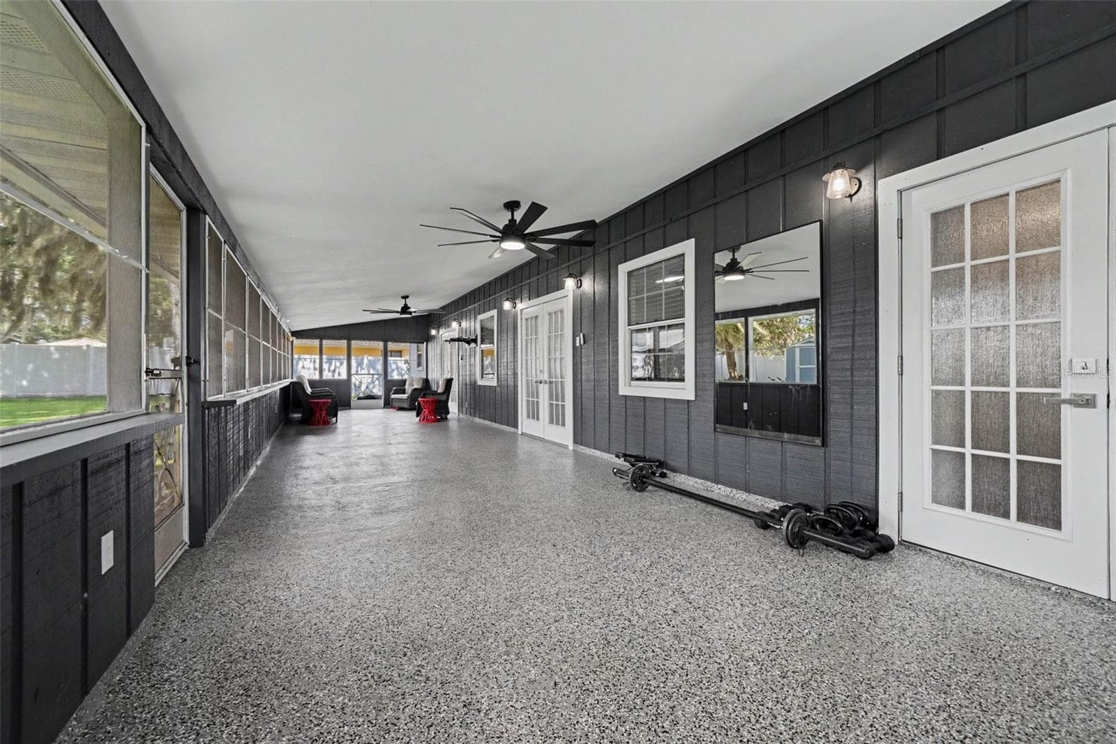 oversized 50'5"x14'10" screened back porch w/2 ceiling fans overlooking large backyard - 1592 SKYLINE DR, KISSIMMEE
