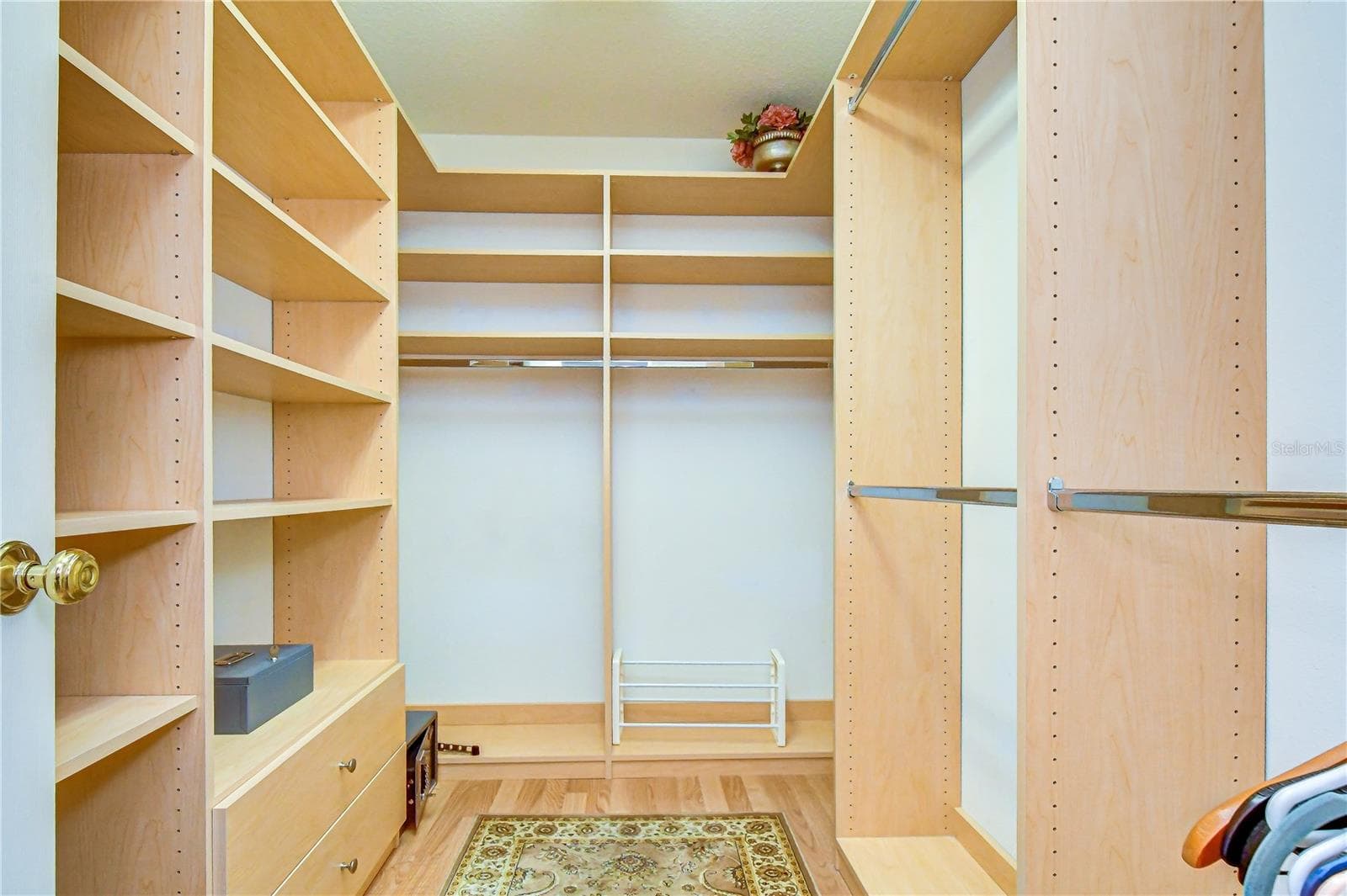 Custom walk-in closet with built-in organization provides exceptional storage. - 5602 ROCKFIELD LOOP, VALRICO