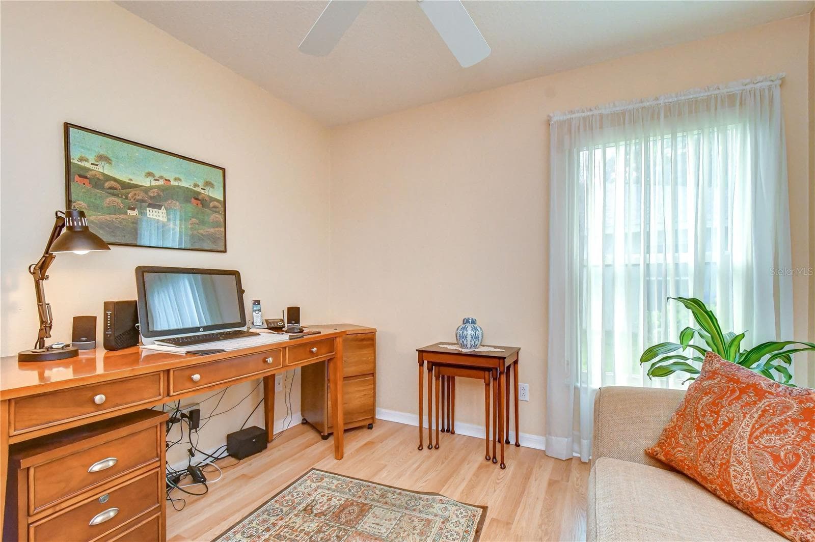 Additional bedroom featuring beautiful wood flooring and currently utilized as a home office. - 5602 ROCKFIELD LOOP, VALRICO