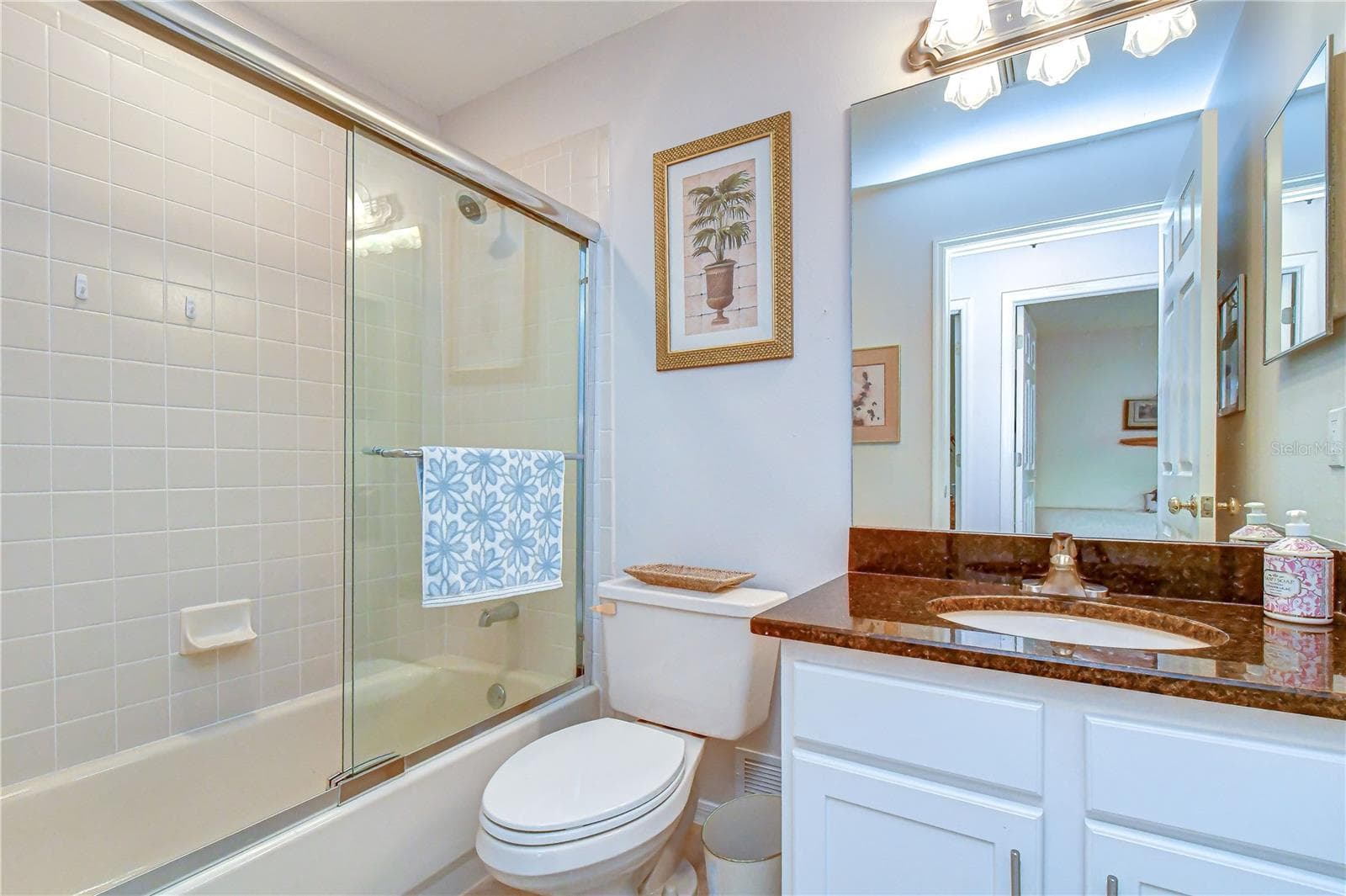 Well-appointed bath conveniently serving the secondary bedrooms. - 5602 ROCKFIELD LOOP, VALRICO