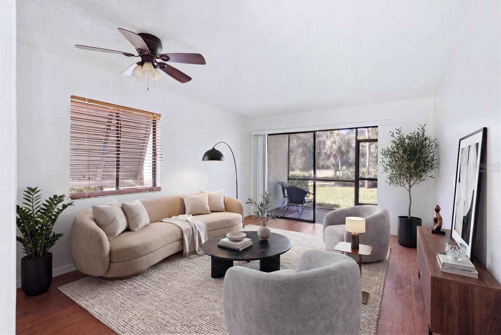 Virtually staged to give your living room a warmer look. - 4528 LONGWATER #35, SARASOTA