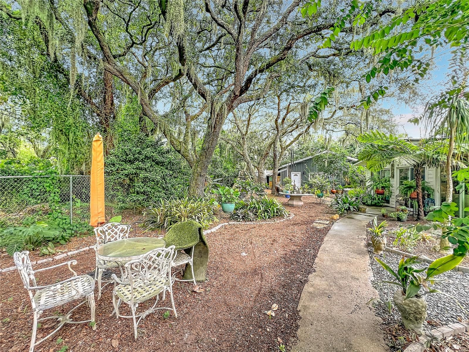 Backyard leading from efficiency apartment to In-law suite - 3851 S SANFORD AVE, SANFORD
