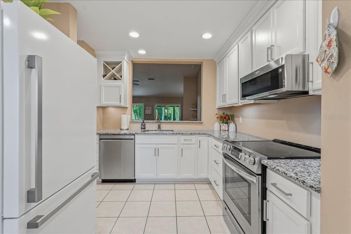 Single Family Residence at 11602 WHITE ASH DR, NEW PORT RICHEY, photo 10 of 58