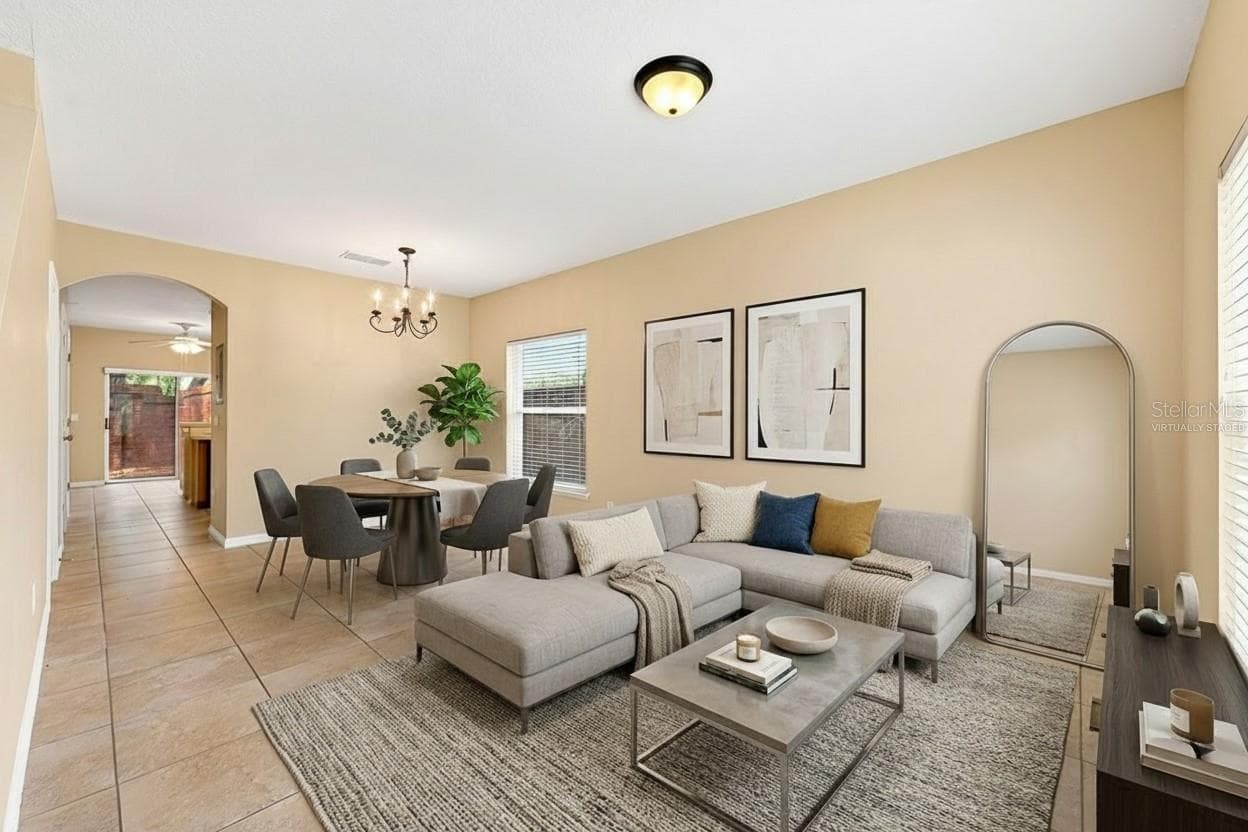 Open living and dining. Virtually Staged. - 102 WILTON CIR, SANFORD