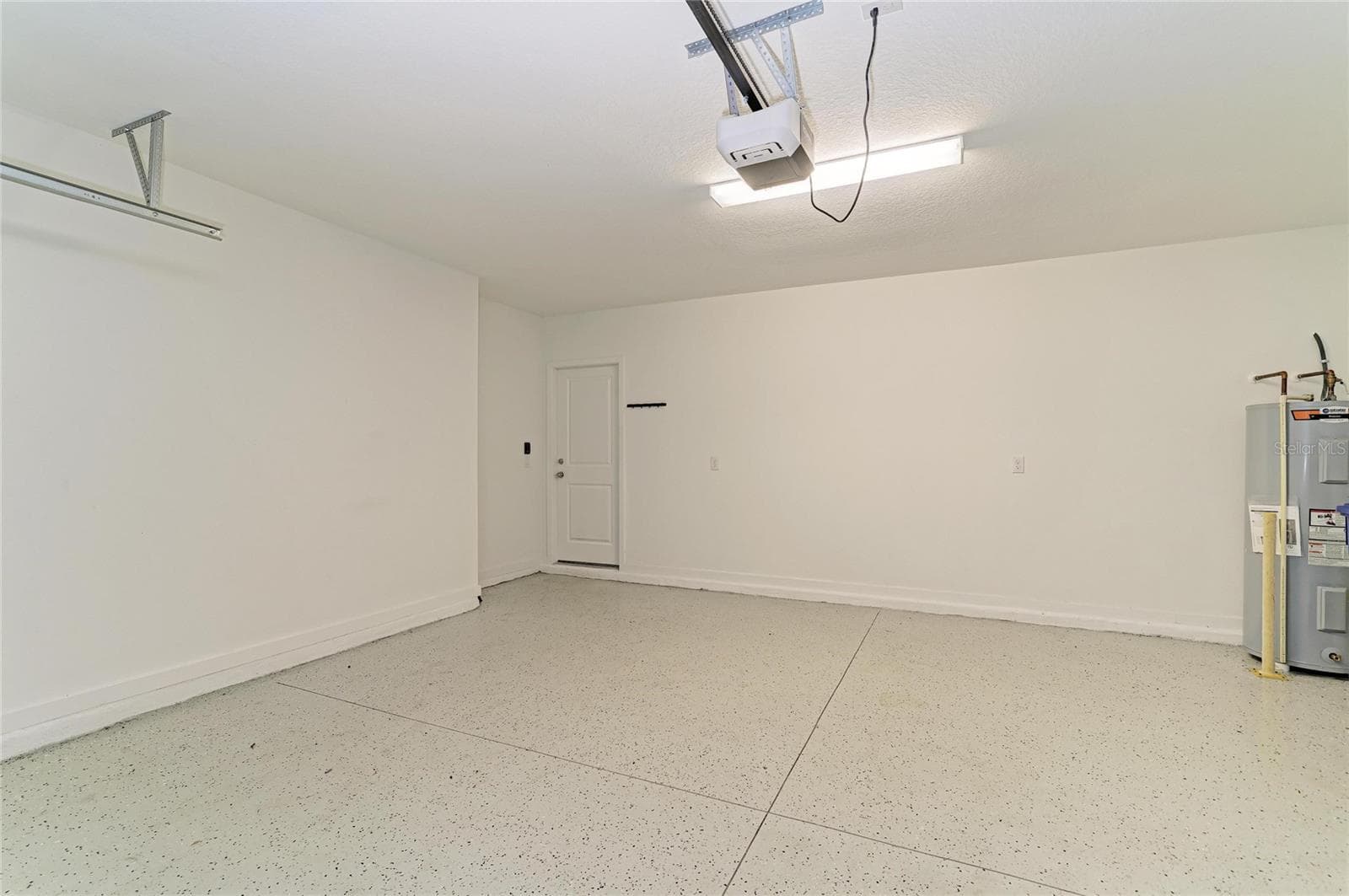 Garage with EPOXY FLOORS - 12703 BLUE REFLECTION AVE, PARRISH