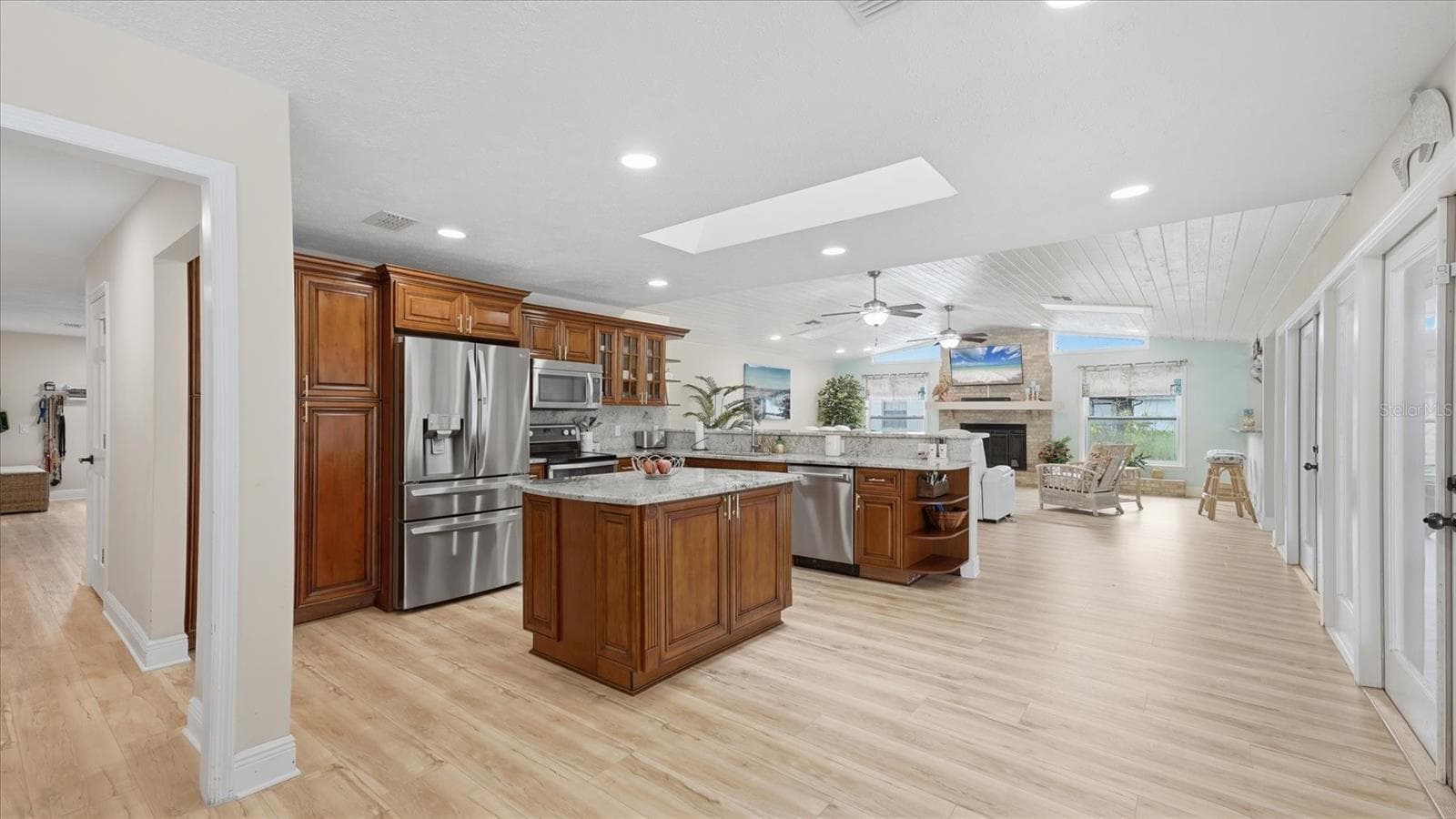 Cozy kitchen/family room is the heart of this home.  New French 4 door refrigerator with ice/water dispenser (2024) - 15127 PENNINGTON RD, TAMPA