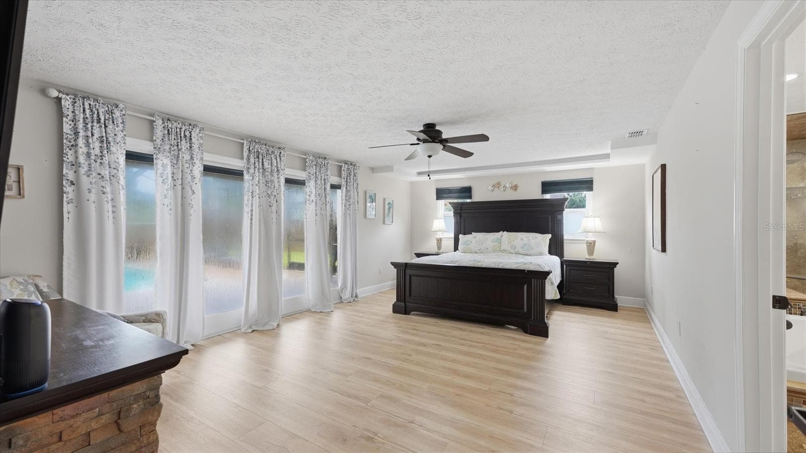 Primary suite offers access to the patio/pool through French Doors - 15127 PENNINGTON RD, TAMPA