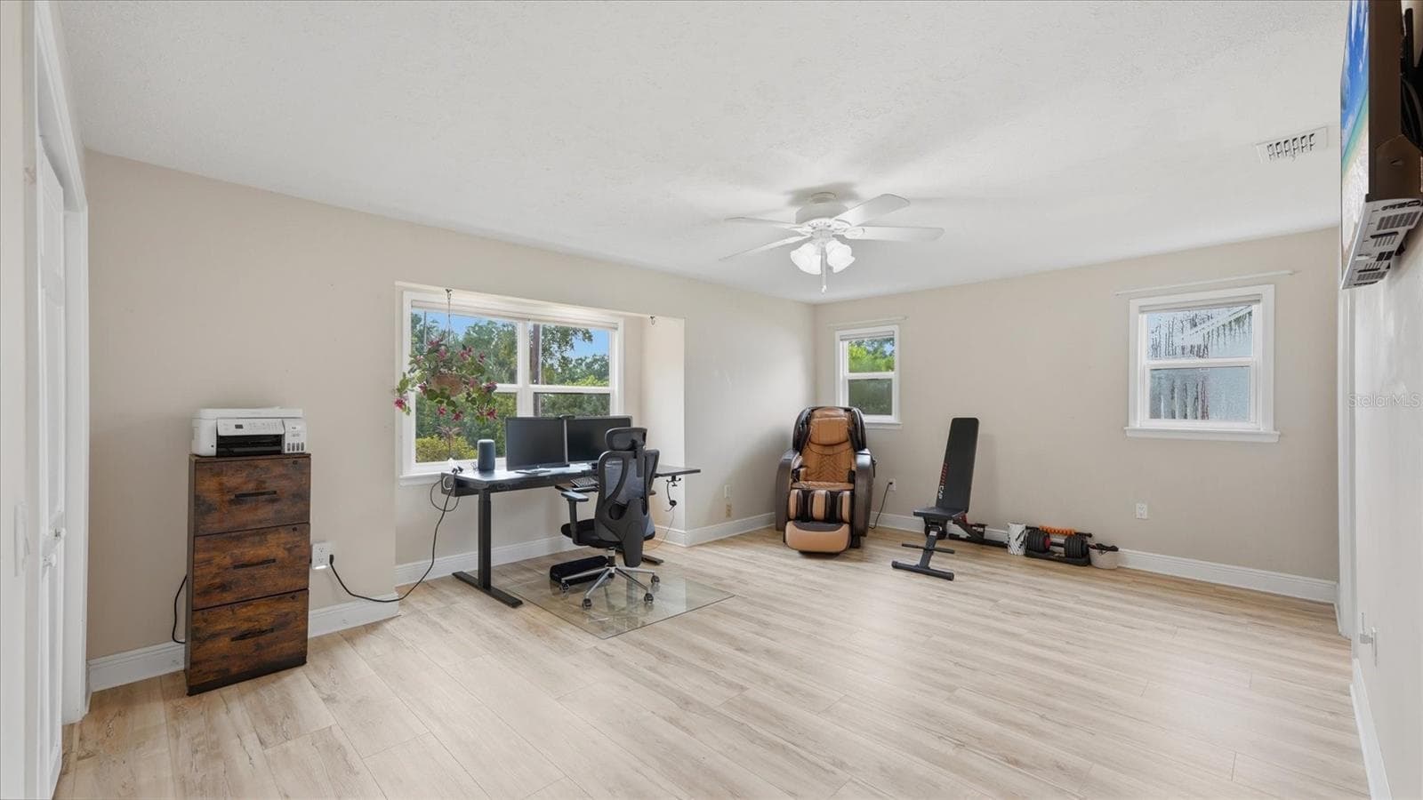 Bedroom 2 currently used as an office is located at the front of the house and connects to an ensuite Jack n Jill bath shared with bedroom 3 - 15127 PENNINGTON RD, TAMPA