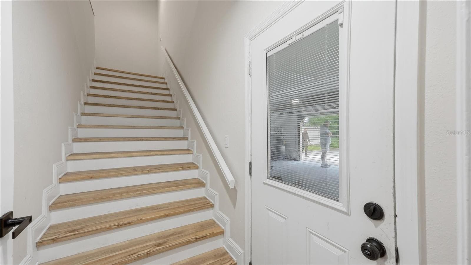 Stairs up to 5th bedroom suite.  Garage is through door - 15127 PENNINGTON RD, TAMPA