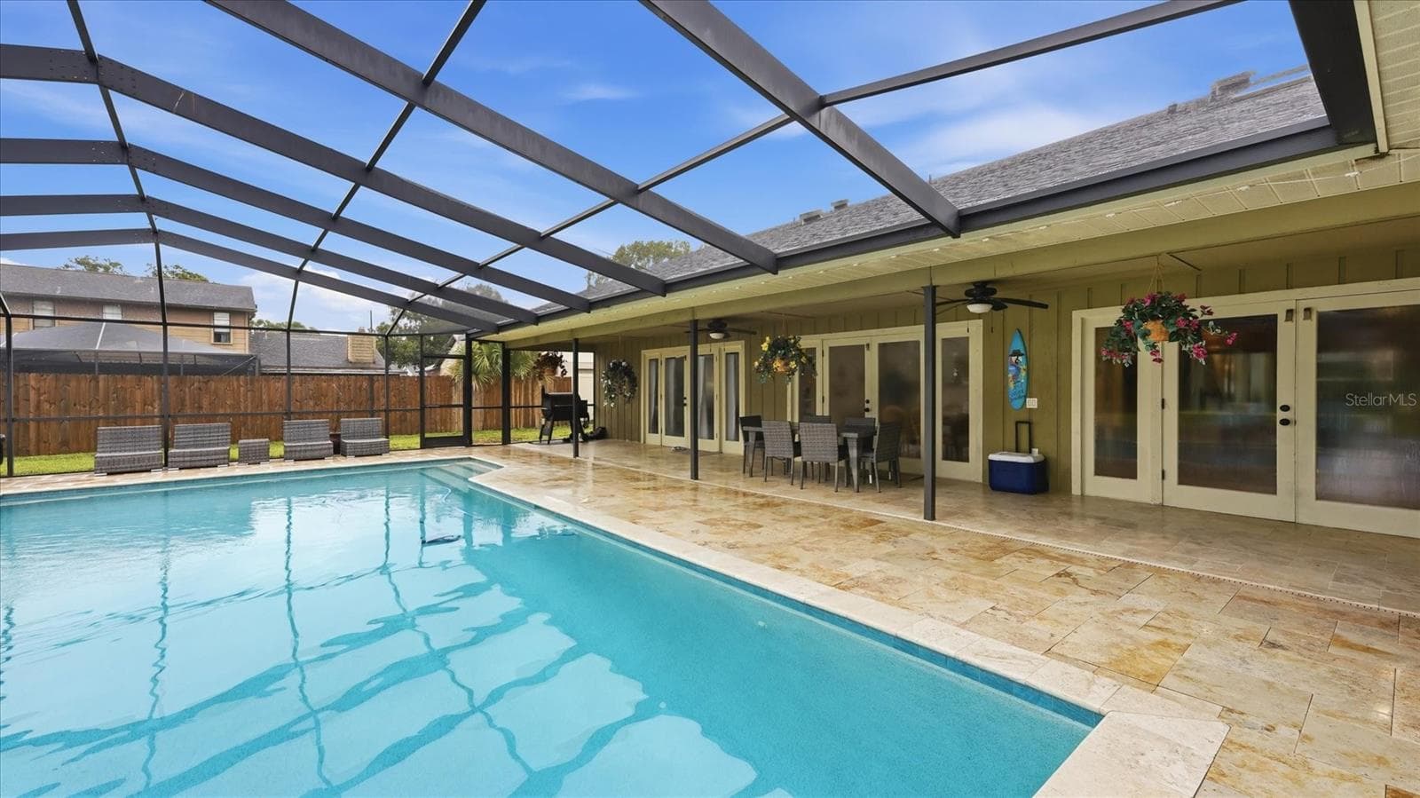 Beautiful travertine paver patio surrounds this massive pool - 15127 PENNINGTON RD, TAMPA