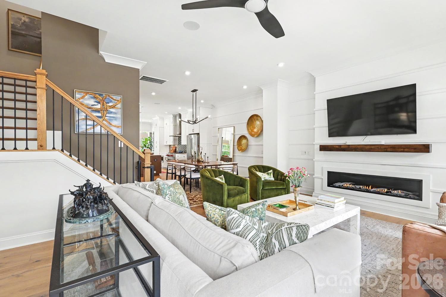 Bright and airy open floor plan featuring distinct, well-defined zones for the kitchen, dining area, and living space, perfect for modern living and entertaining. - 2505 Kenmore Avenue, Charlotte