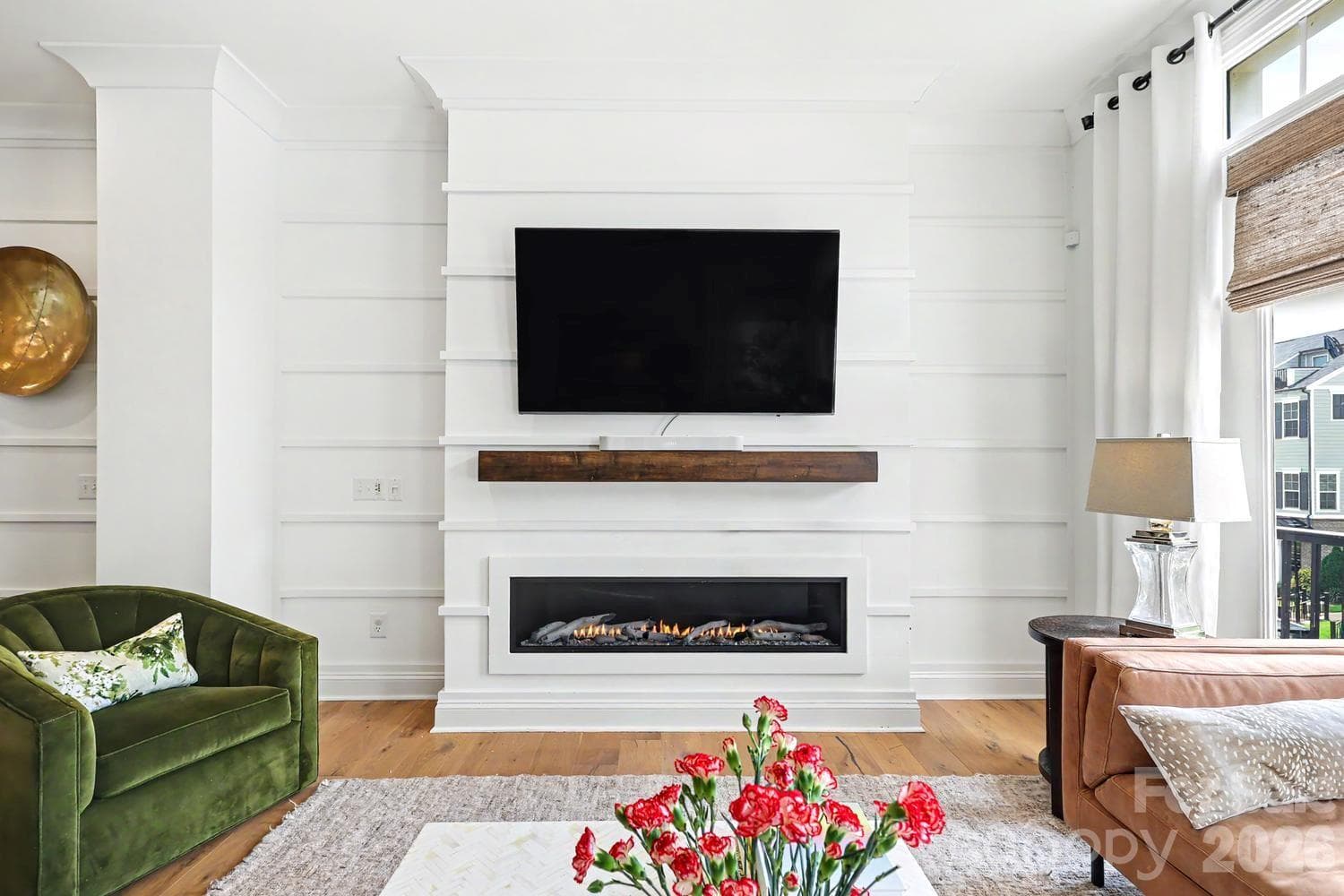 This property features a stunning, recently installed gas fireplace that offers customizable lighting colors and settings, adding both warmth and modern ambiance to the living space. - 2505 Kenmore Avenue, Charlotte
