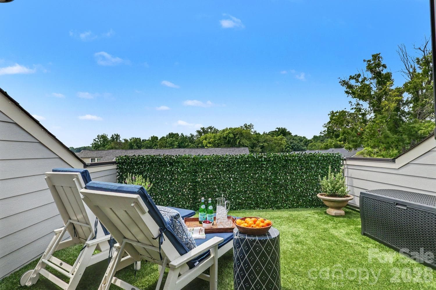 Sunny rooftop deck with lounge seating and panoramic city views. - 2505 Kenmore Avenue, Charlotte