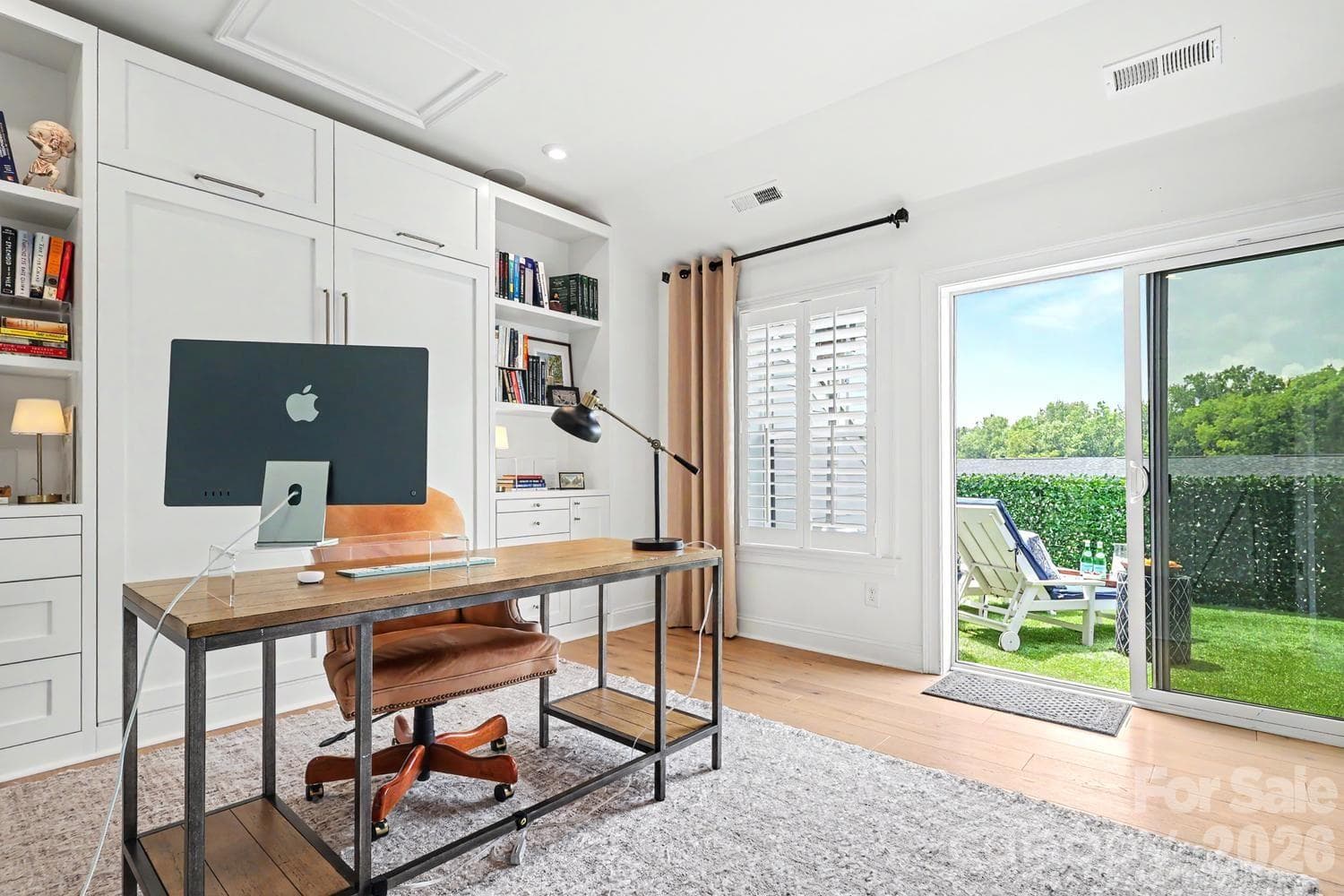Bedroom 4: Versatile space featuring a built-in Murphy bed, allowing for seamless transition between a functional home office and a comfortable bedroom. - 2505 Kenmore Avenue, Charlotte