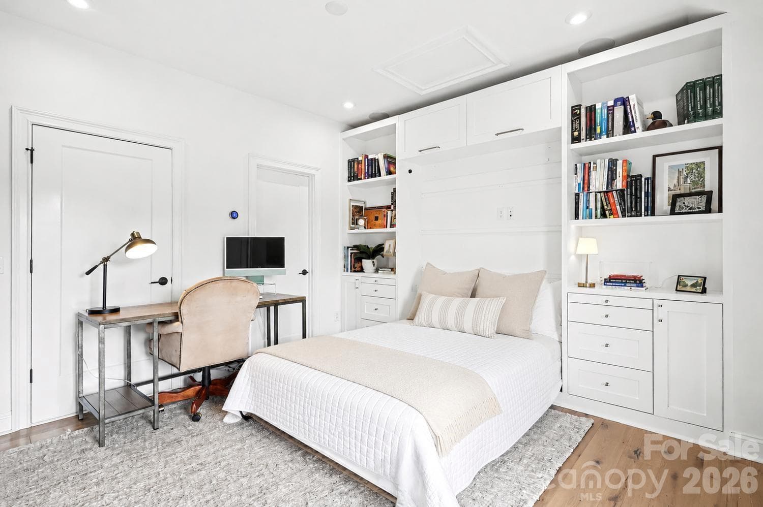 This Murphy bed features custom built-in side tables that seamlessly extend directly from the integrated storage drawers. - 2505 Kenmore Avenue, Charlotte