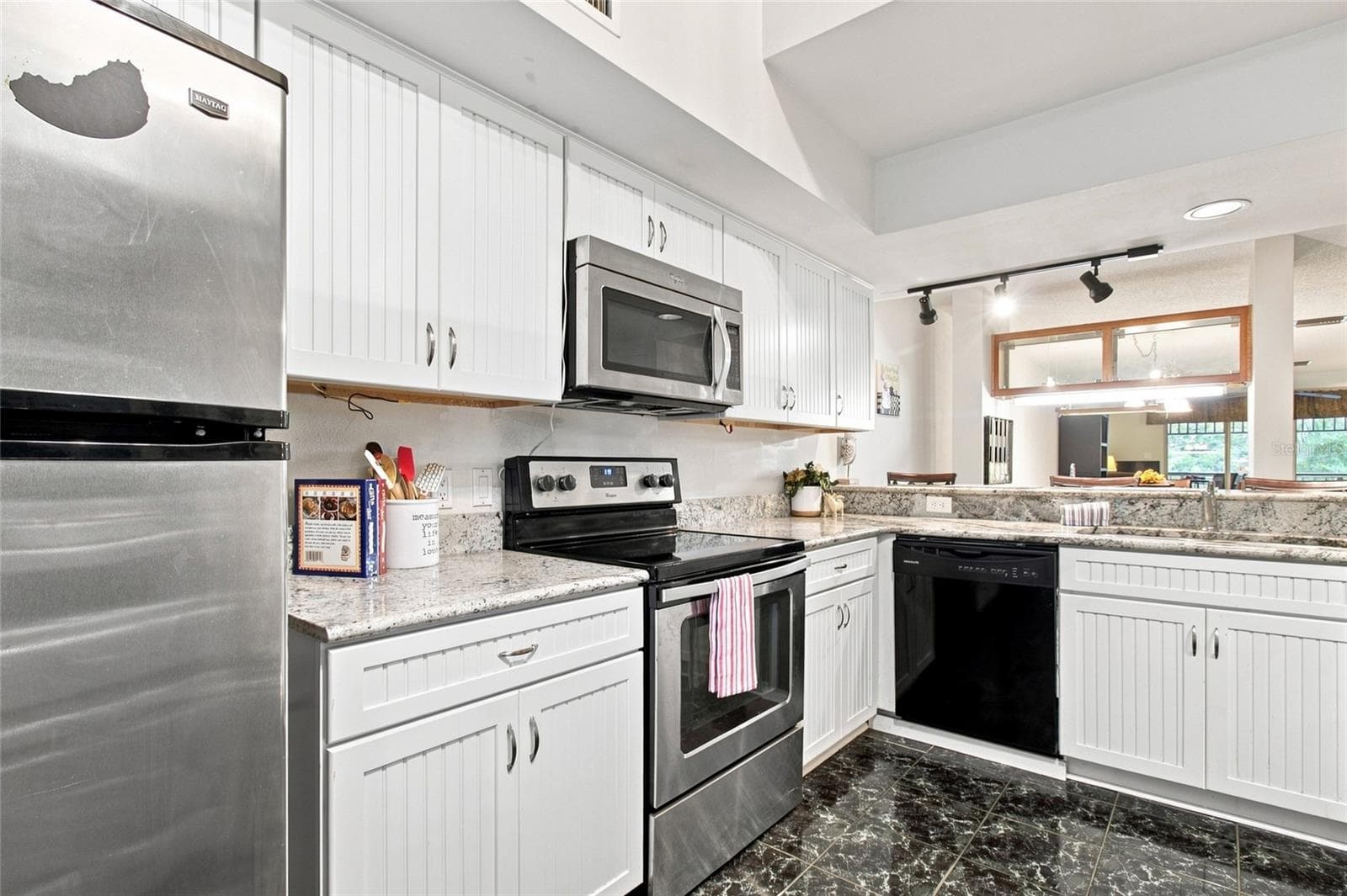 Kitchen with Breakfast Bar - 2599 DOLLY BAY DR #306, PALM HARBOR