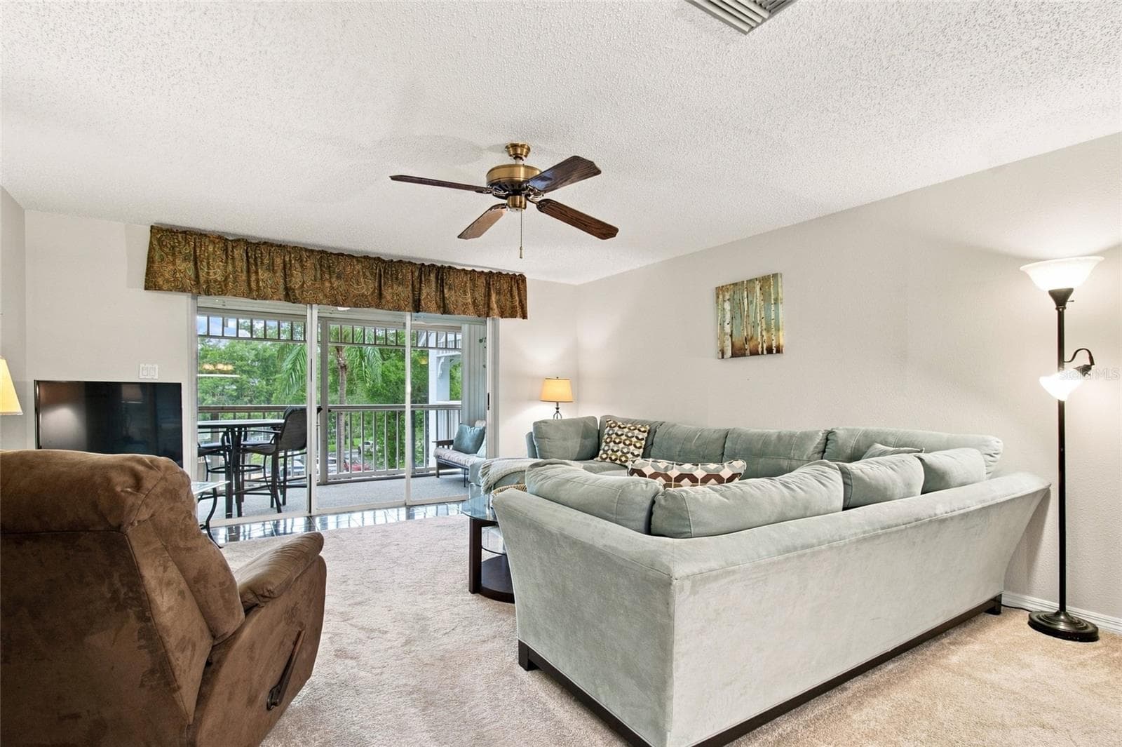 Spacious Living Room out to Lanai - 2599 DOLLY BAY DR #306, PALM HARBOR