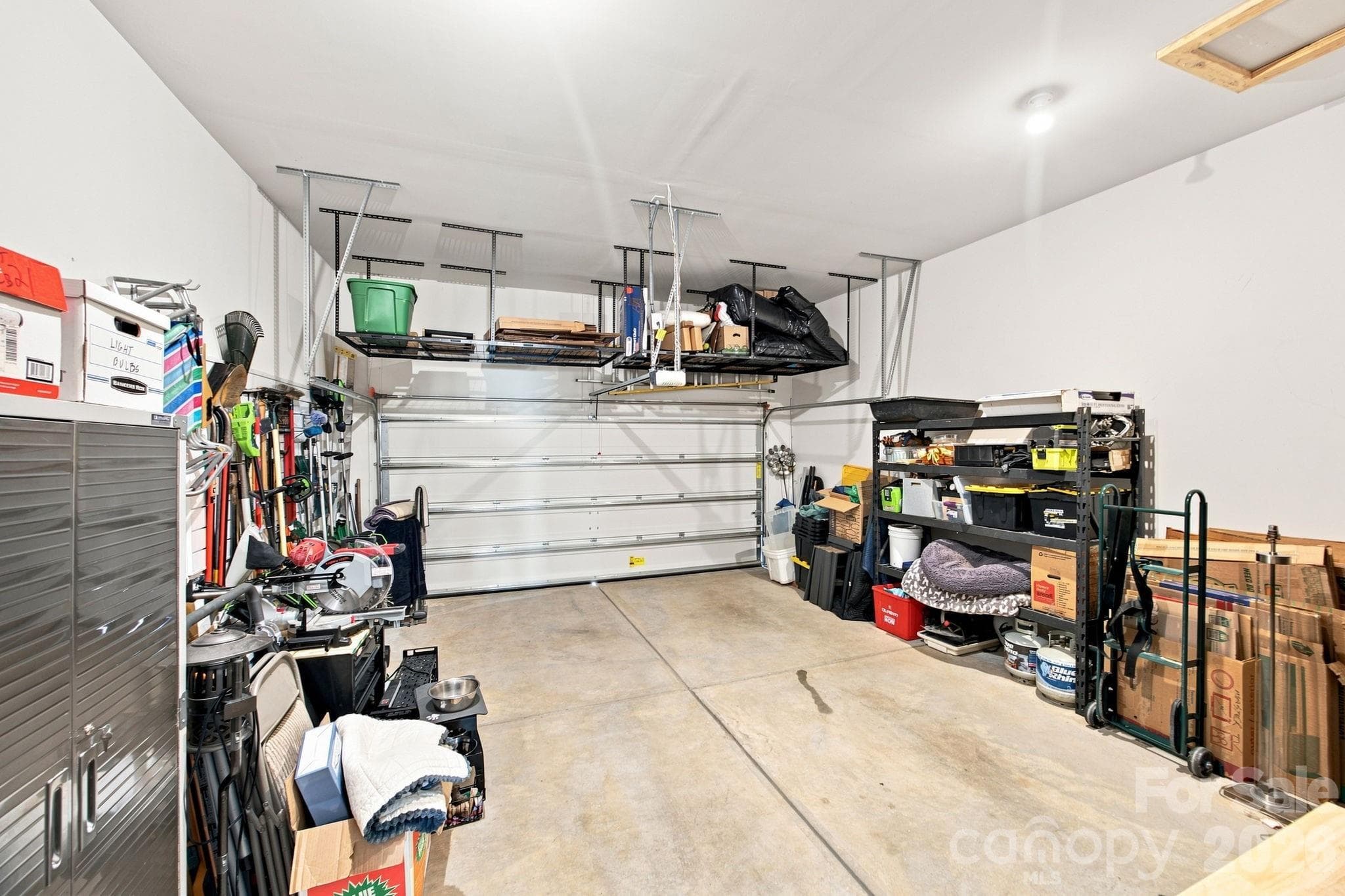 Garage with storage shelf - 8125 Warford Little Road, Denver