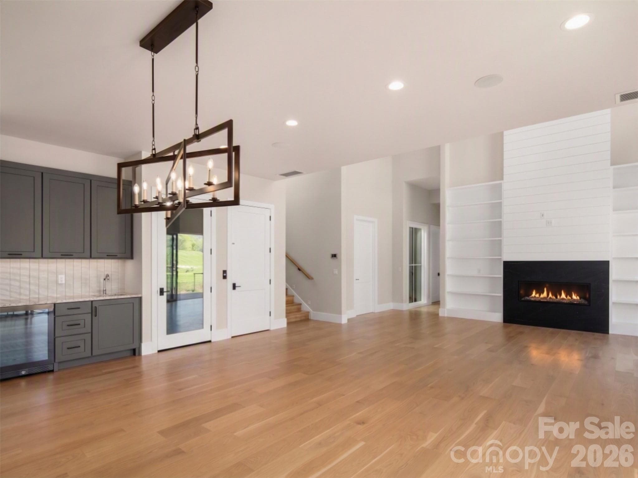 Virtually edited to include completed fireplace. - Arden