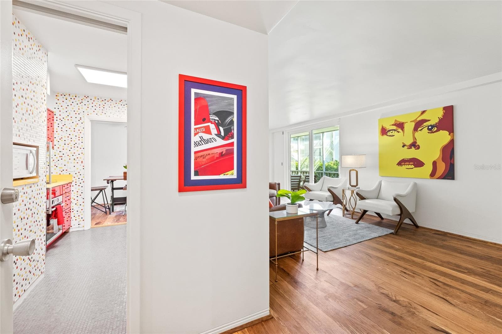 Step inside and be greeted by a newly renovated residence. The flooring is new throughout and is a high-quality vintage wood. - 1012 N SHORE DR NE #14, ST PETERSBURG
