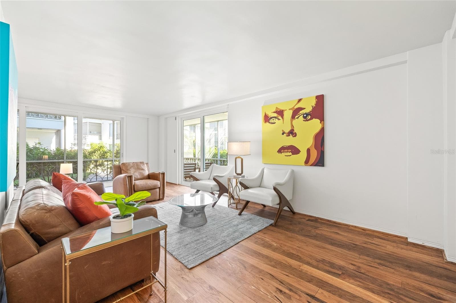 Plenty of natural light comes in through the NEW high-impact sliding doors that line the living and dining spaces. - 1012 N SHORE DR NE #14, ST PETERSBURG