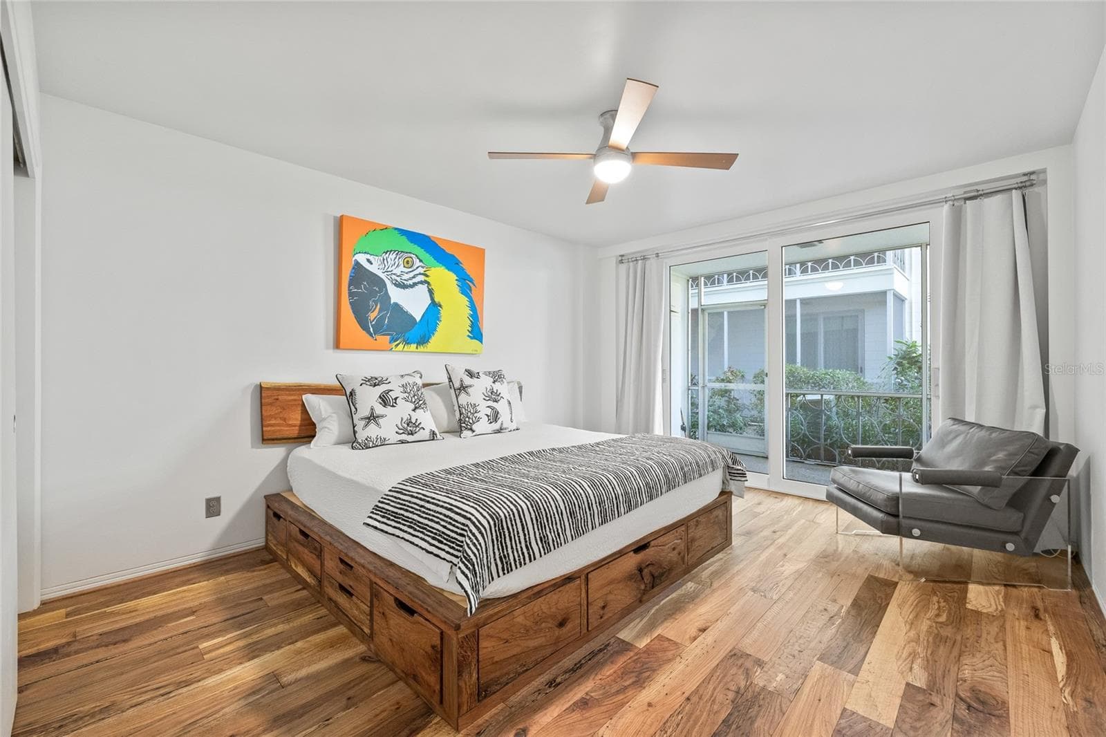 Spacious bedroom with enough room for a dedicated seating area. There is also an entrance to your screened-in patio off of this room. - 1012 N SHORE DR NE #14, ST PETERSBURG
