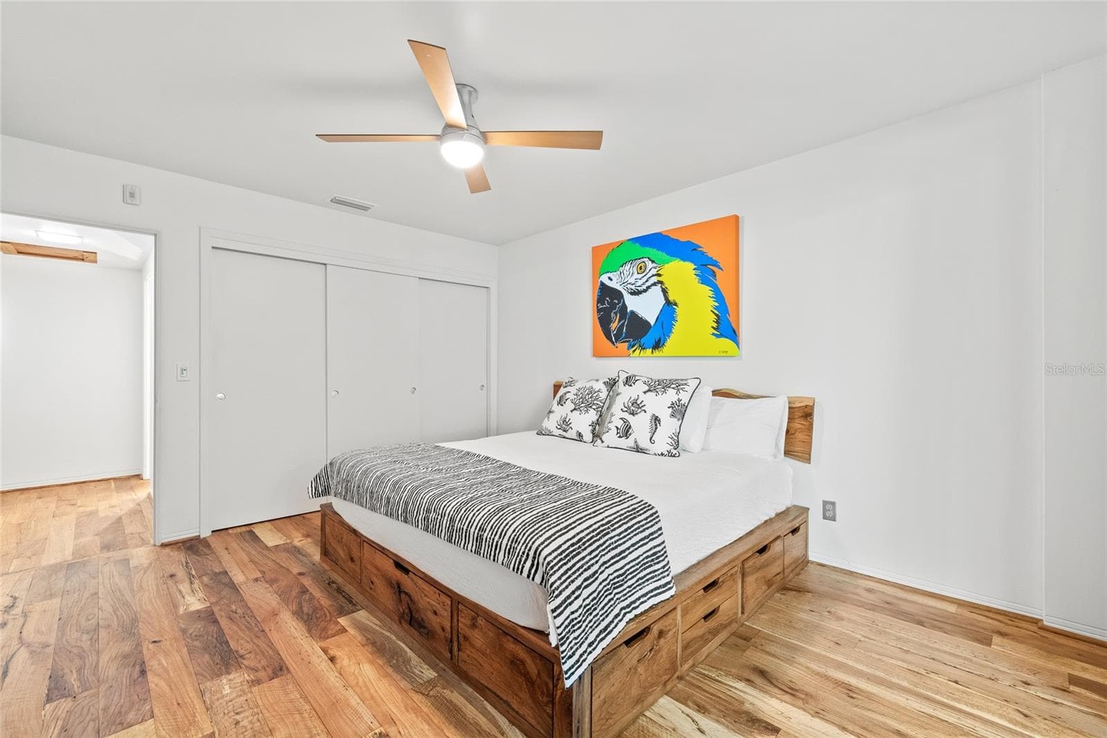 The bedroom includes a deep closet and a ceiling fan. - 1012 N SHORE DR NE #14, ST PETERSBURG