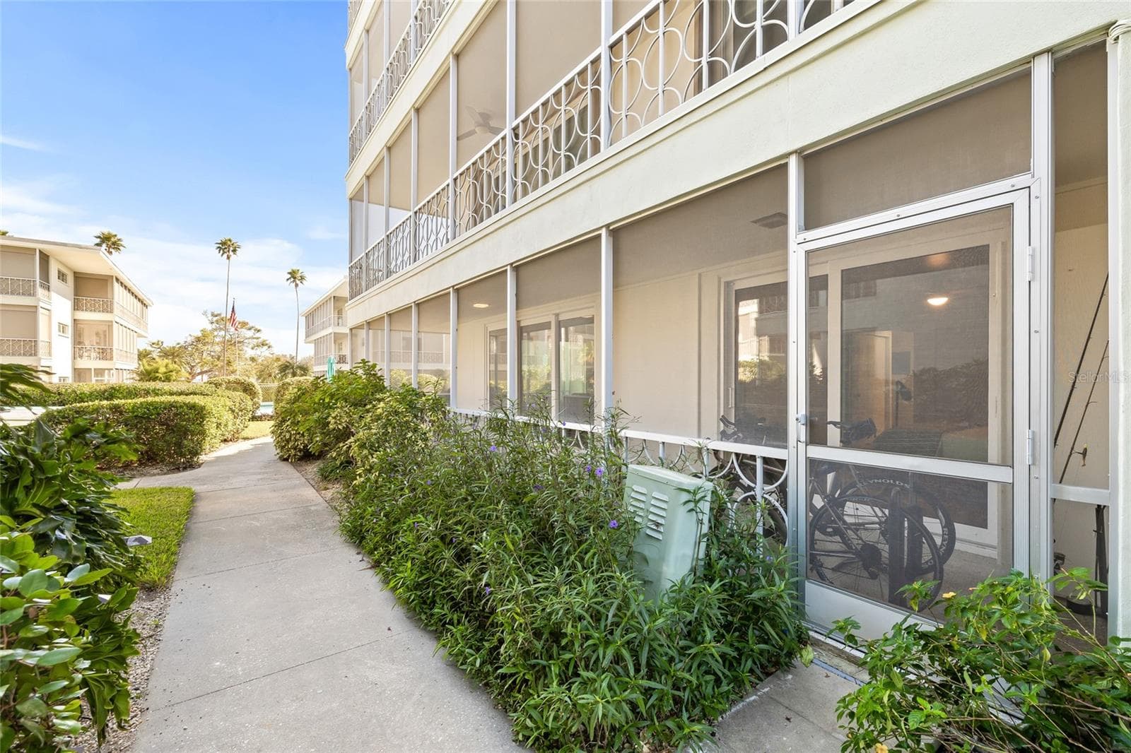 This is the walking path right outside of the patio. You can easily take your bikes out this way and start your ride without going through the front door and the common hallway to get outside. - 1012 N SHORE DR NE #14, ST PETERSBURG