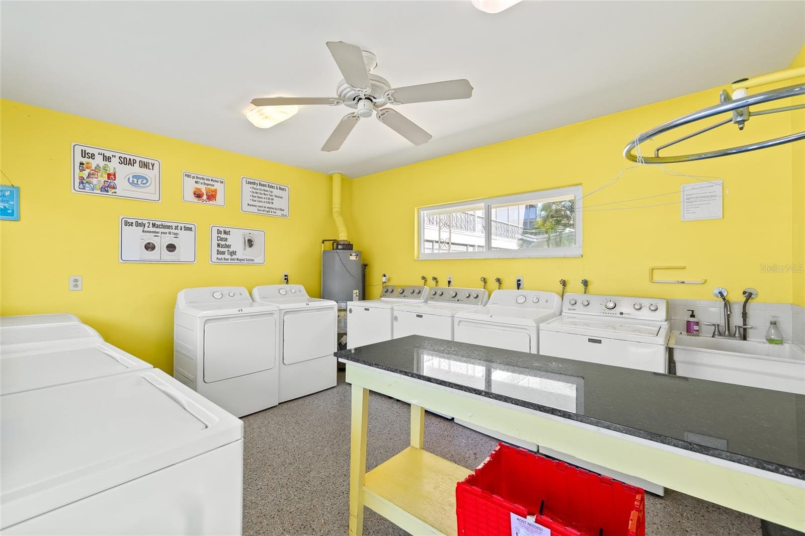 The onsite laundry room is well-maintained and offers plenty of washers and dryers. - 1012 N SHORE DR NE #14, ST PETERSBURG