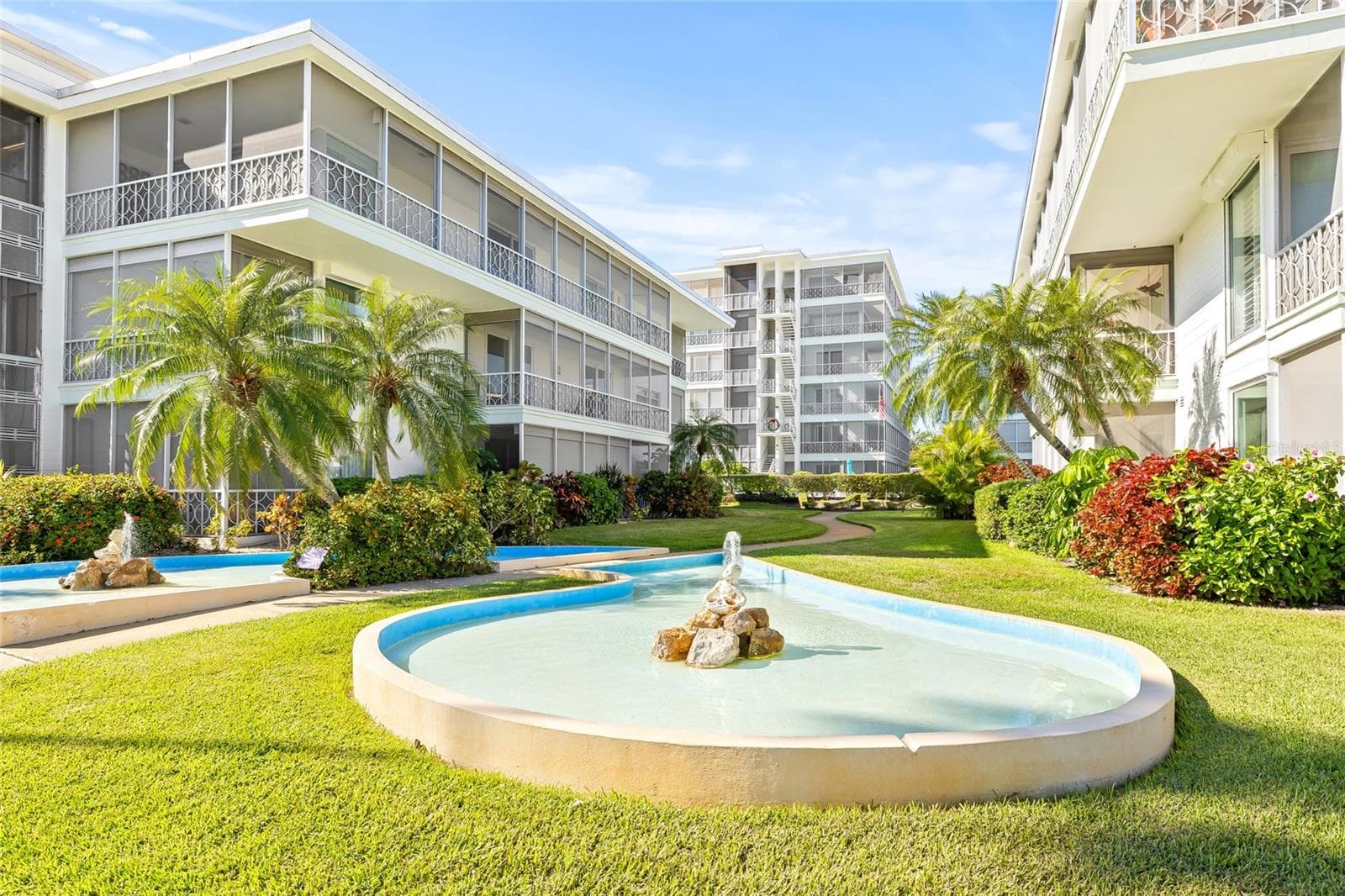 The community has beautiful features, like peaceful waterfalls and lush landscaping that line the sidewalks, making it very pleasant when you come home. - 1012 N SHORE DR NE #14, ST PETERSBURG