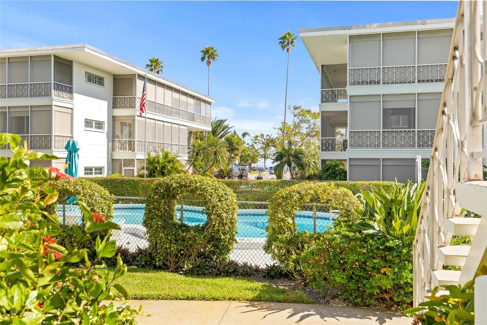 This is the view as you walk out of the building. The pool is right there; you can also see some Tampa Bay water views and North Shore Park. - 1012 N SHORE DR NE #14, ST PETERSBURG