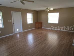 Great room with door to screened porch - 1122 VIRGINIA CT, EUSTIS