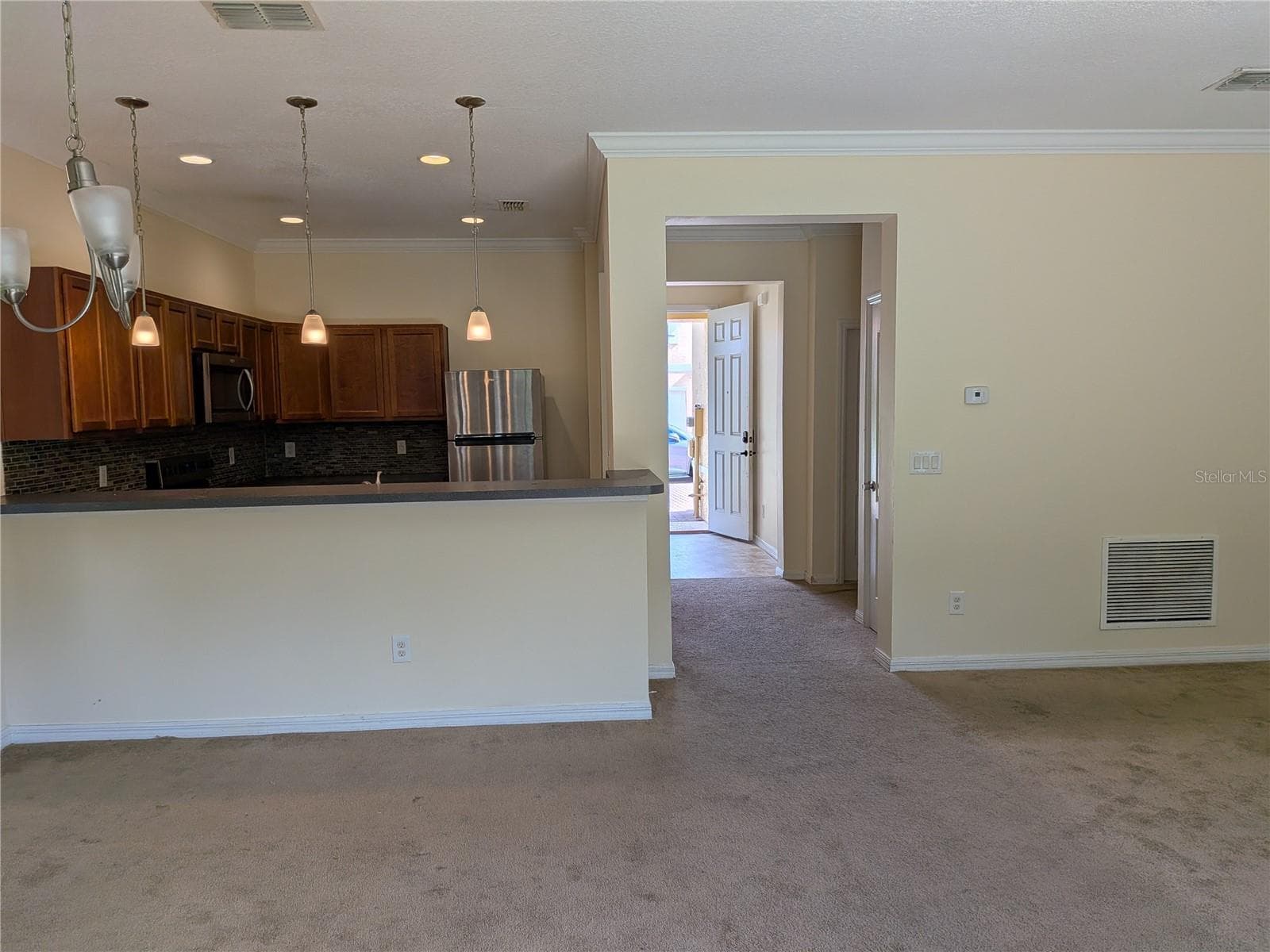 view looking at the kitchen and front door - 1187 CHERVIL DR, POINCIANA