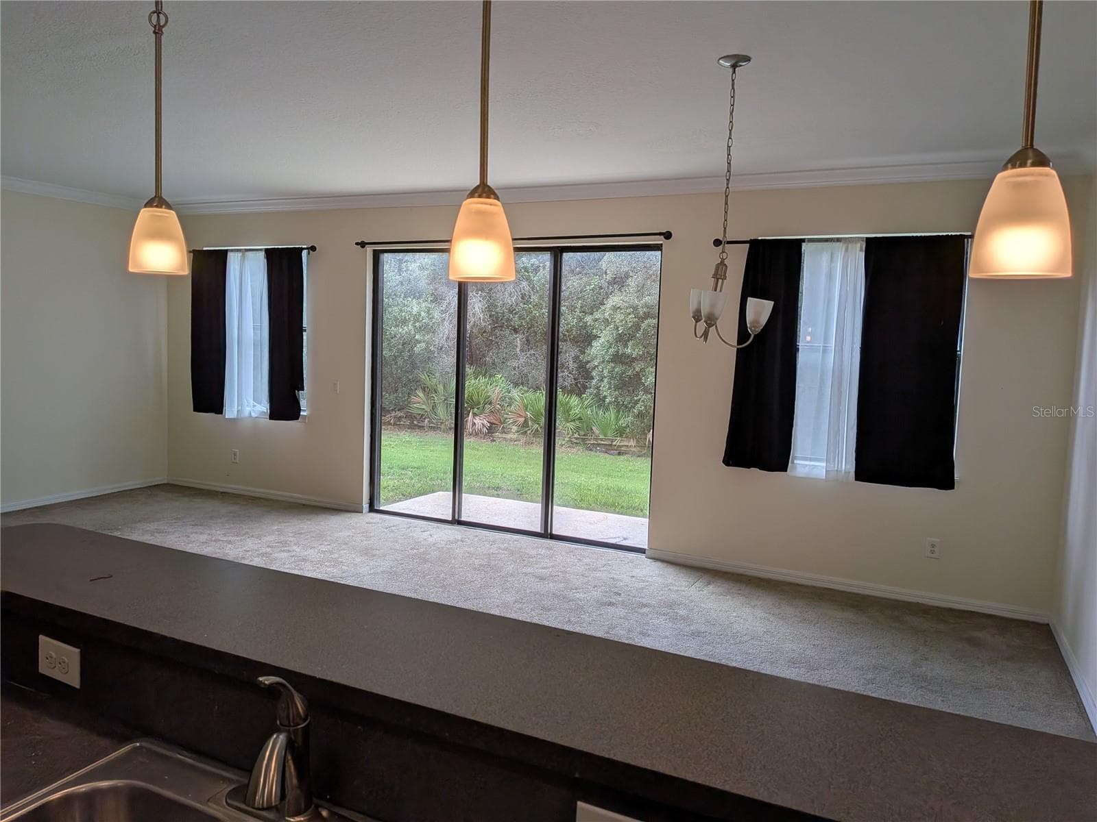 view from Kitchen to Living / dining room combo - 1187 CHERVIL DR, POINCIANA