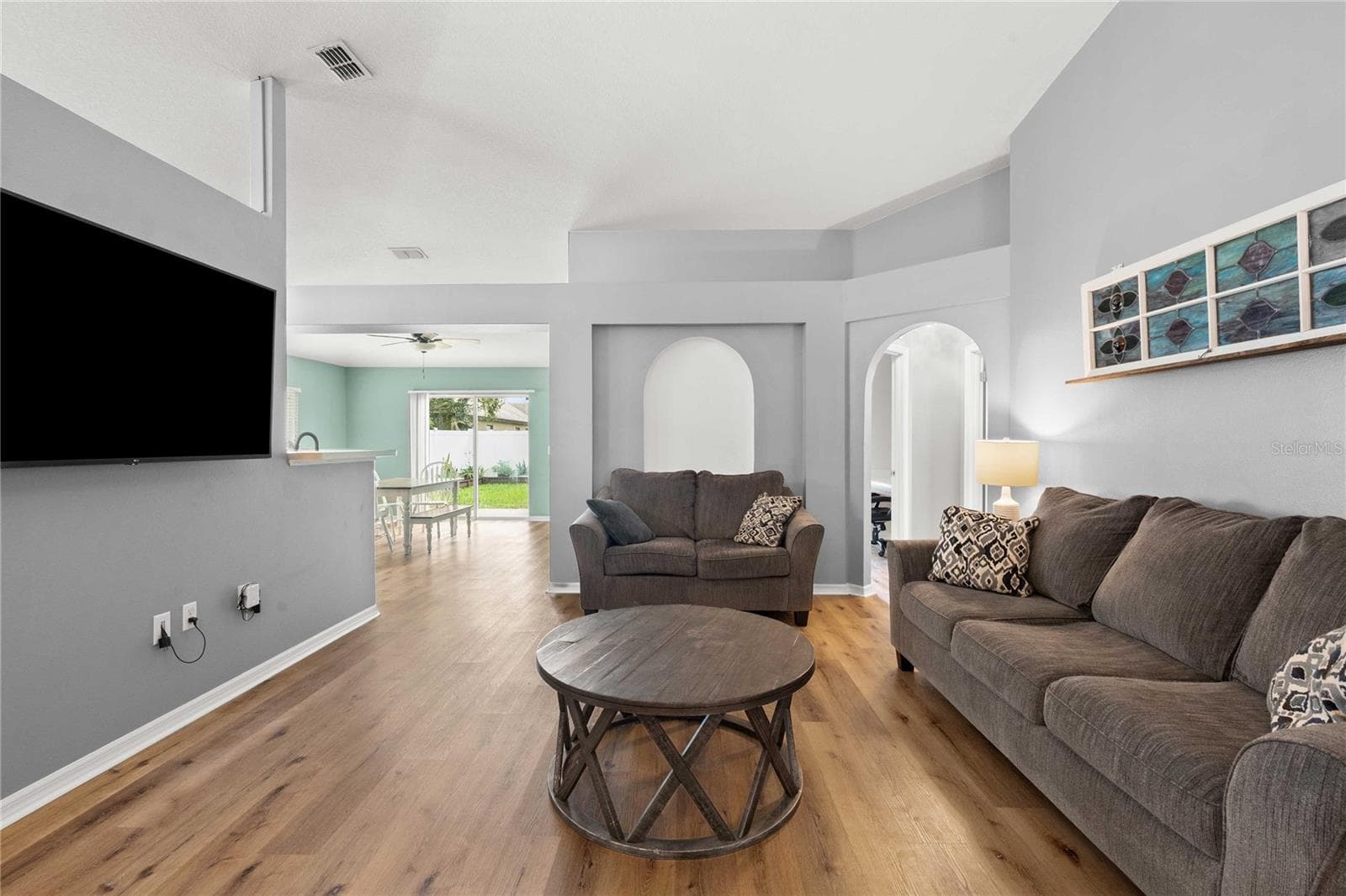 Living room with view to dining area - 14423 FINSBURY DR, SPRING HILL