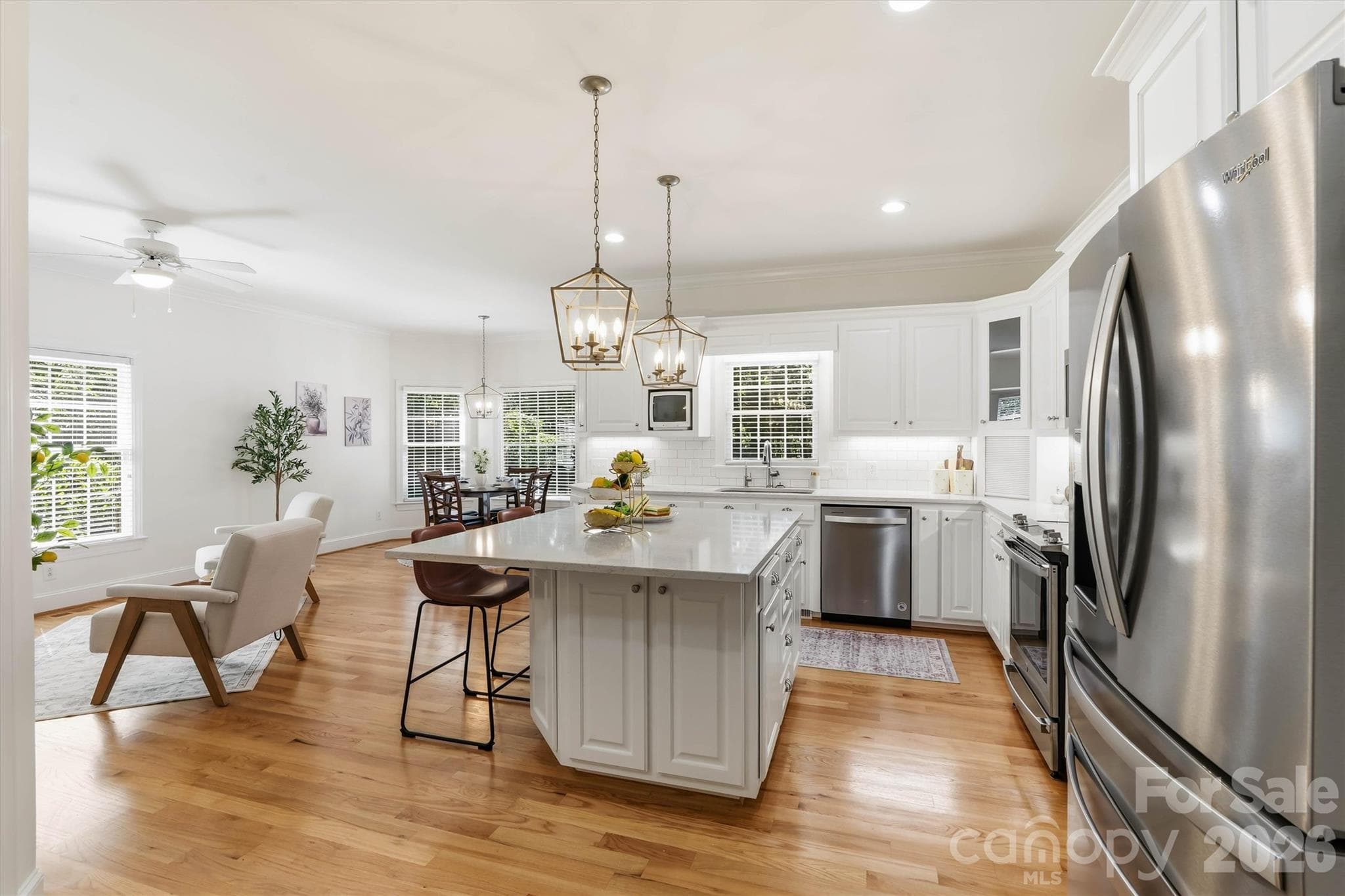 You will never feel alone while cooking and preparing food. This Kitchen has a gas log fireplace and seating area to converse with guests. It also has a dining area in the breakfast nook, with tons of natural light and an entrance to the oversized deck. Perfect for bringing food in and out when grilling and entertaining outdoors - 675 Heather Drive, Lincolnton