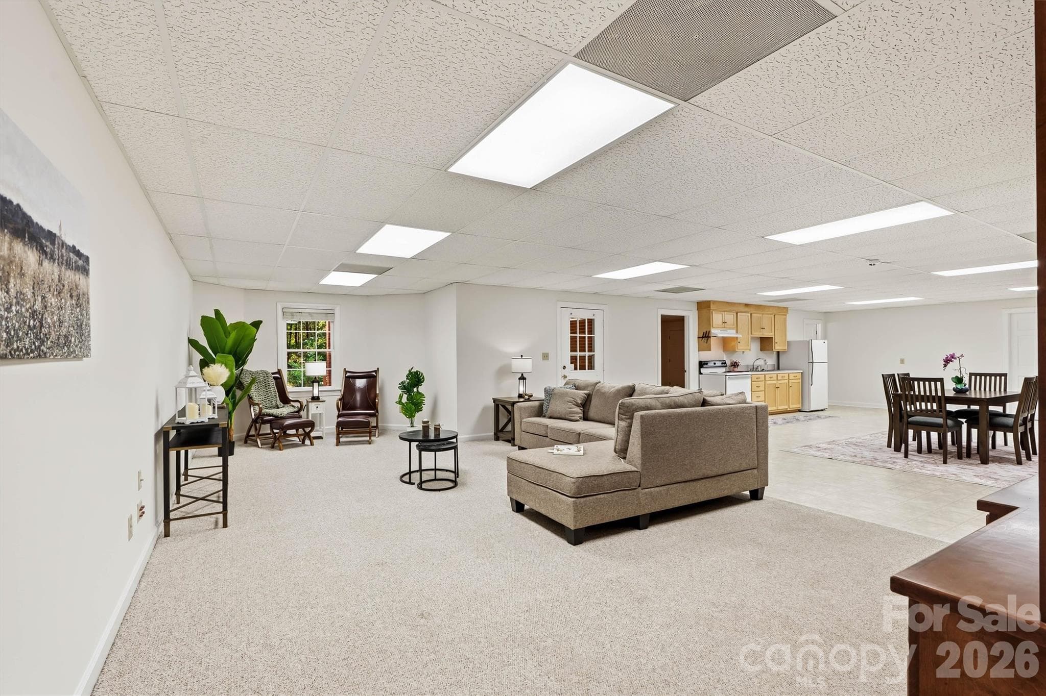 Enter the lower level finished basement. This area is perfect for recreation and/or multigenerational living. Open concept with plenty of space and light - 675 Heather Drive, Lincolnton