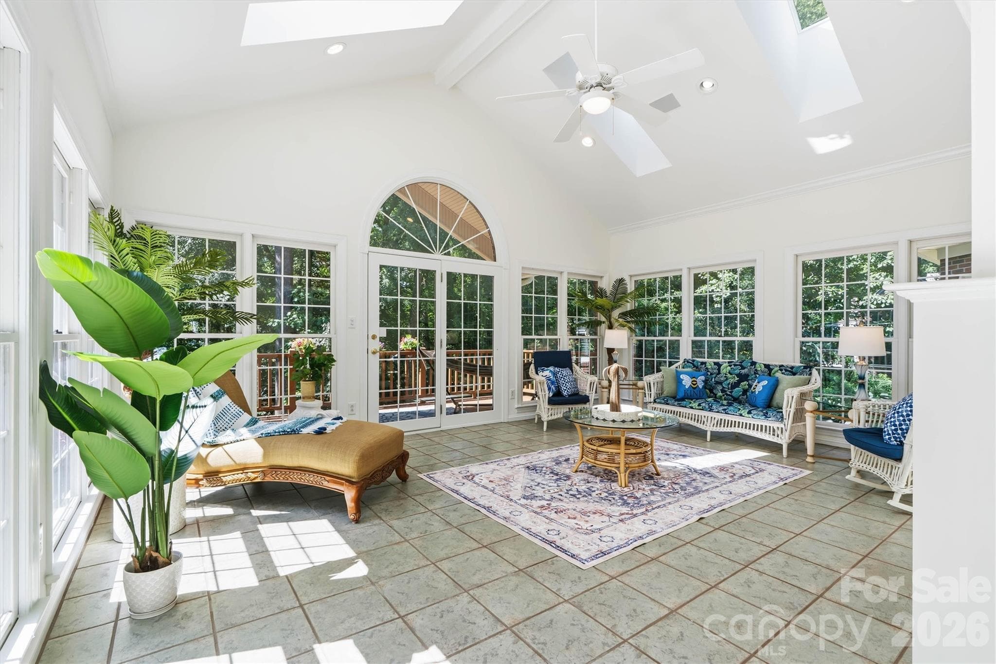This is a favorite room in this home! A Sunroom with exterior doors leading to the covered outdoor deck. - 675 Heather Drive, Lincolnton